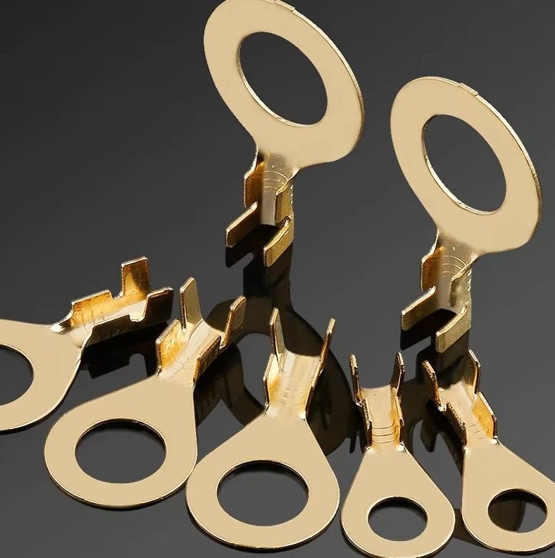 Copper ring lugs connectors set, assorted sizes for secure electrical wiring connections.