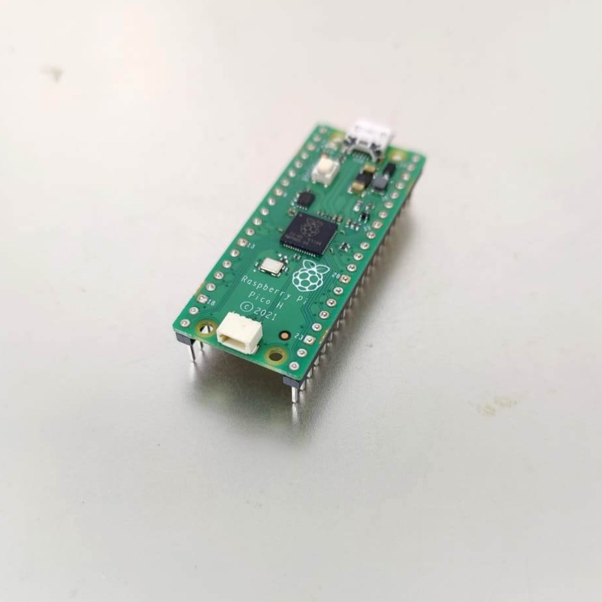 Raspberry Pi Pico H RP2040 microcontroller board with headers for electronics projects and development.