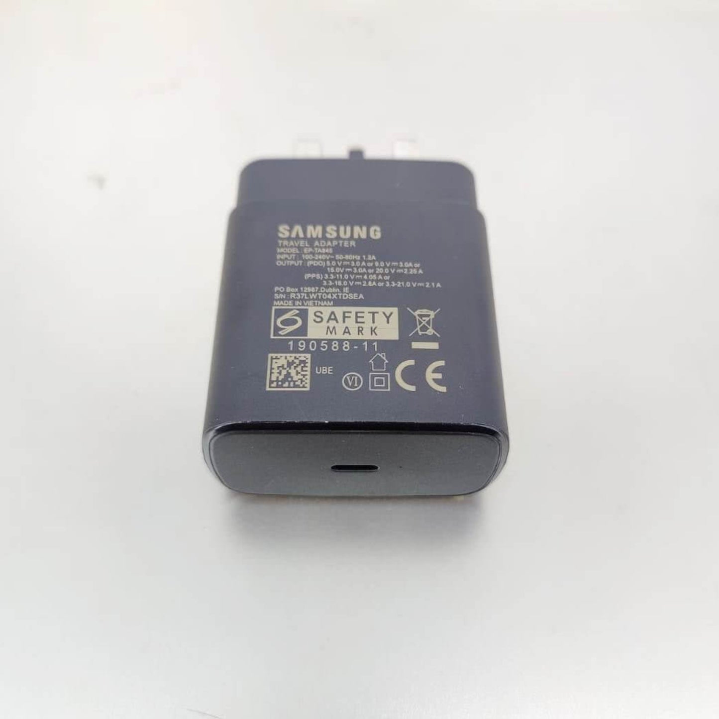 Close-up of the technical specifications and USB-C port on the Samsung 45W charger, model EP-TA845.