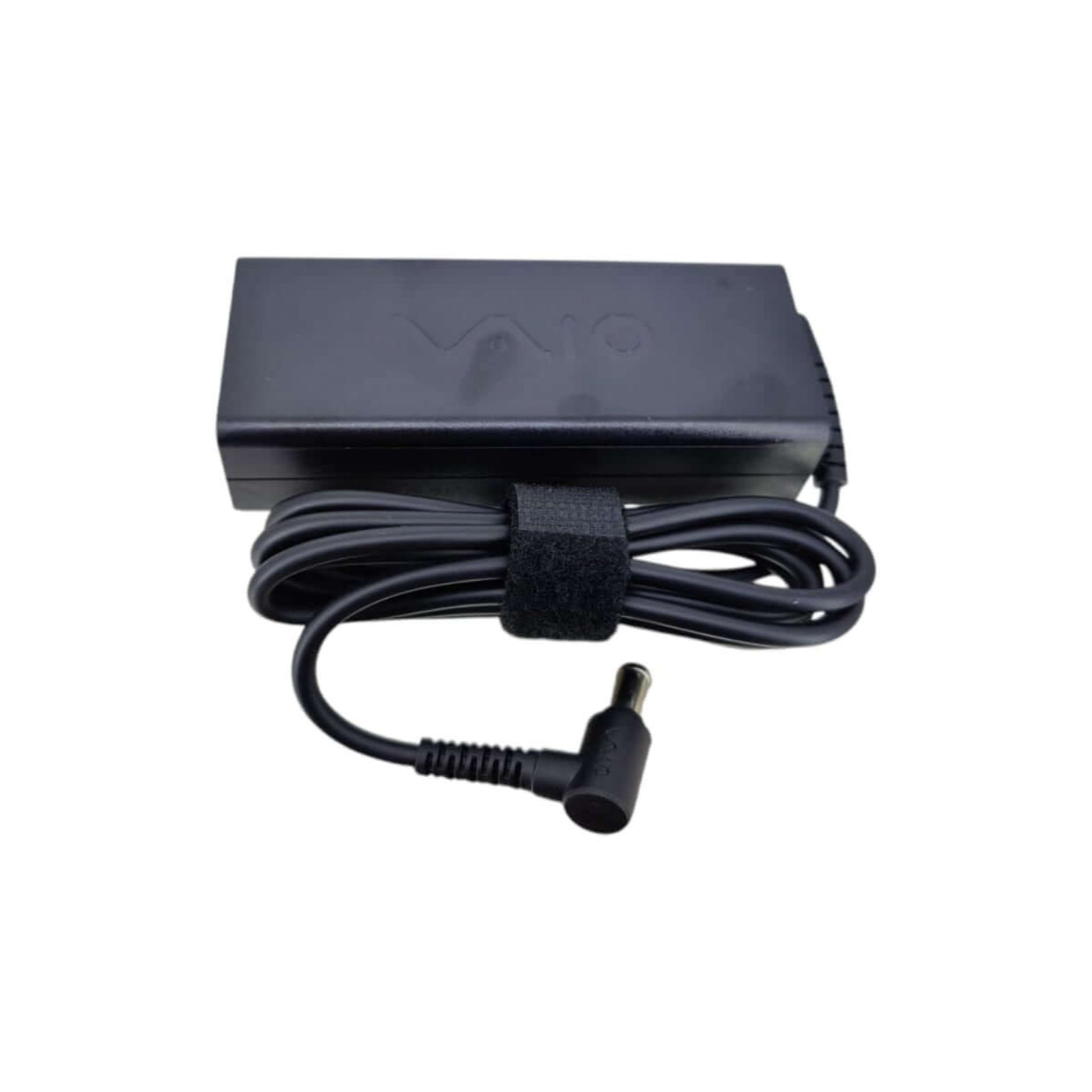 Sony 19.5V 4.7A 90W laptop charger with power cable wrapped, ready for use.