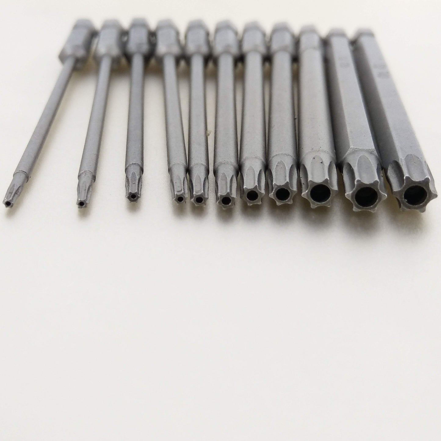 A close-up view showing the various sizes and hollow tips of the tamper-proof security Torx screwdriver bits.