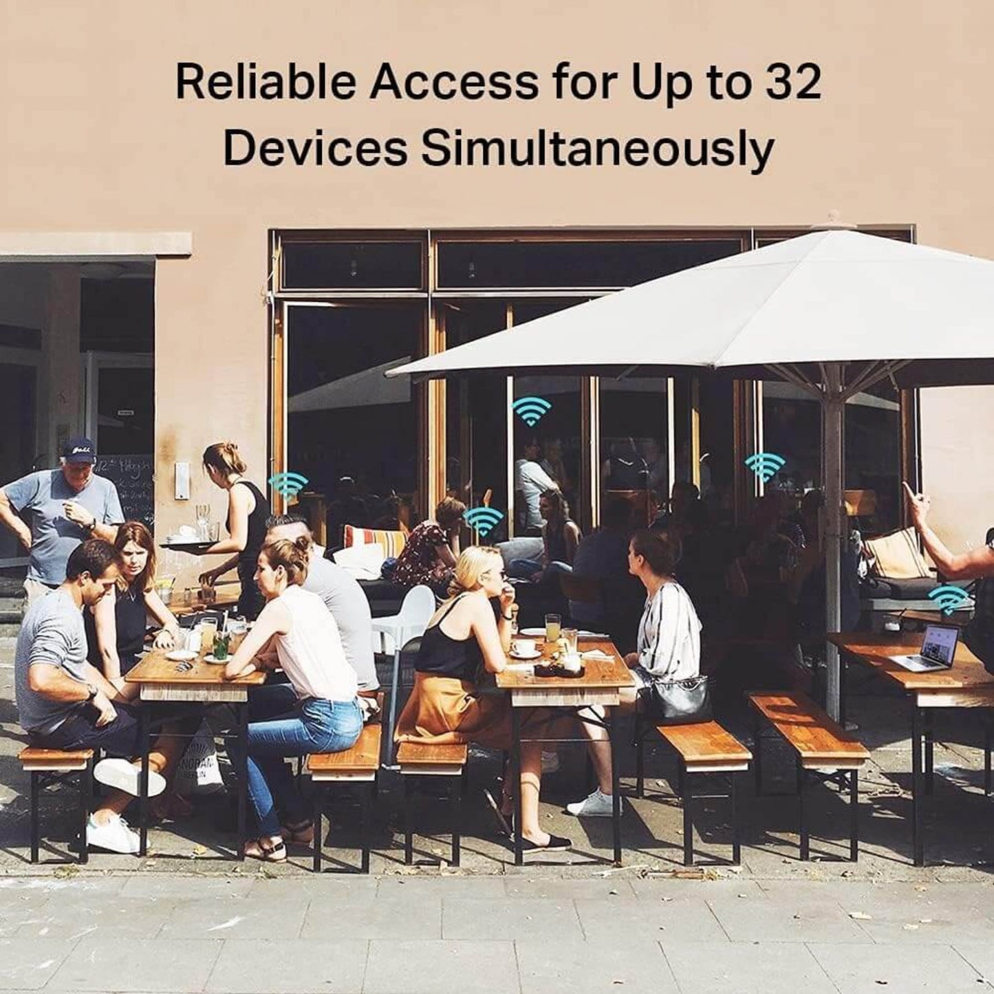 Group of people at a cafe using TP-Link router for internet access for 32 devices simultaneously.