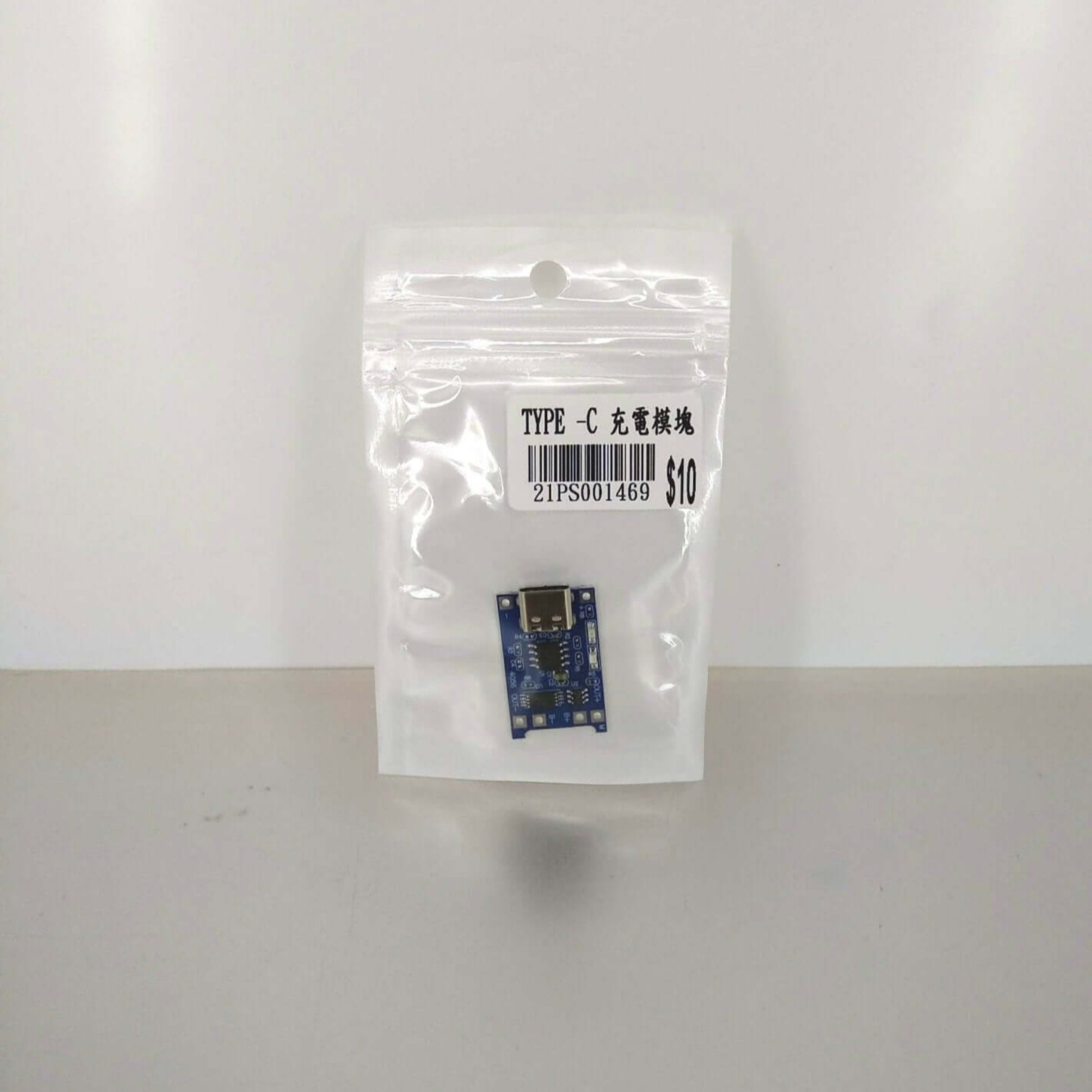 TP4056 Type-C USB lithium battery charger module in packaging for safe charging of 18650 batteries.