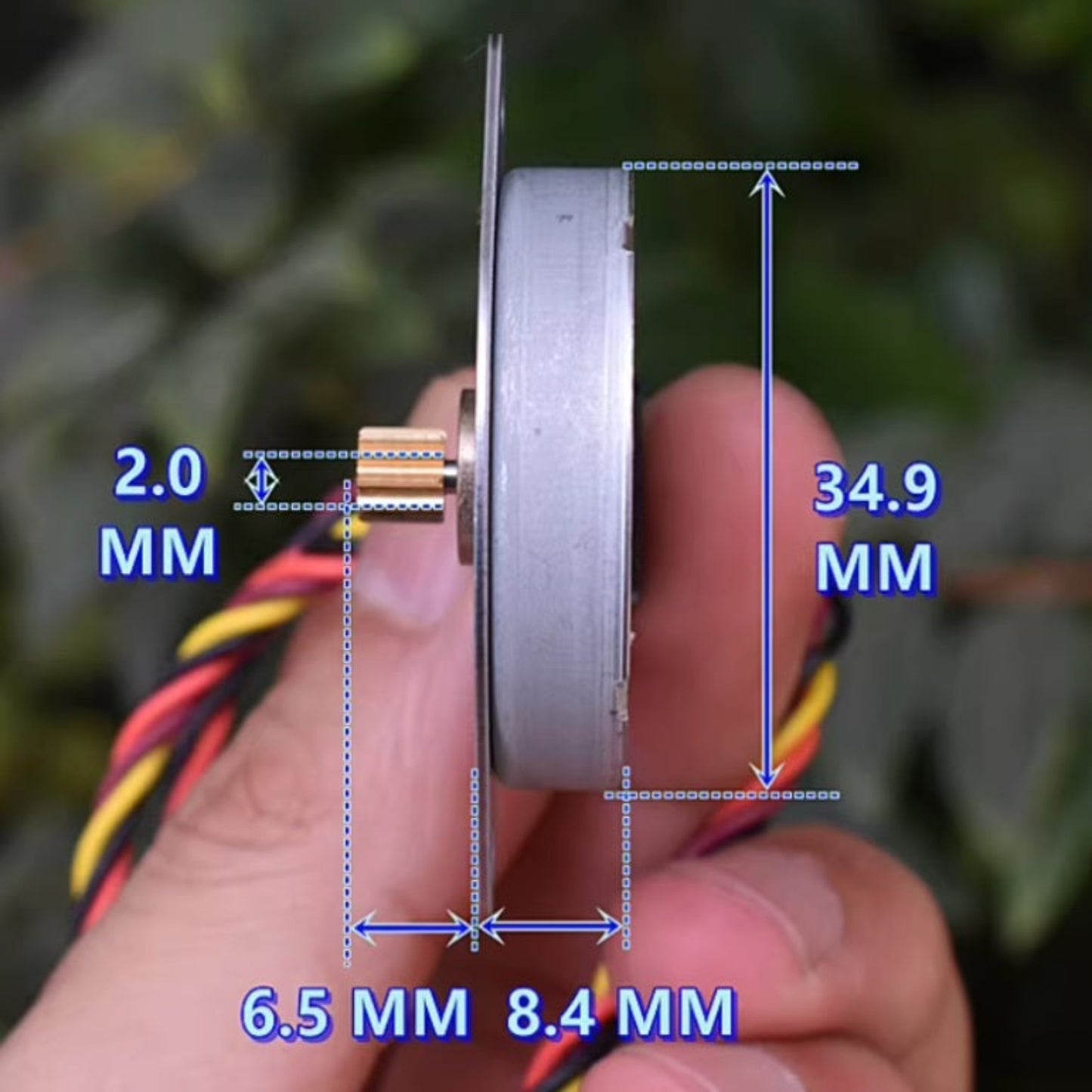 Side profile of an ultra-thin 35mm stepper motor showing the 8.4mm thickness and 2.0mm shaft with brass gear.