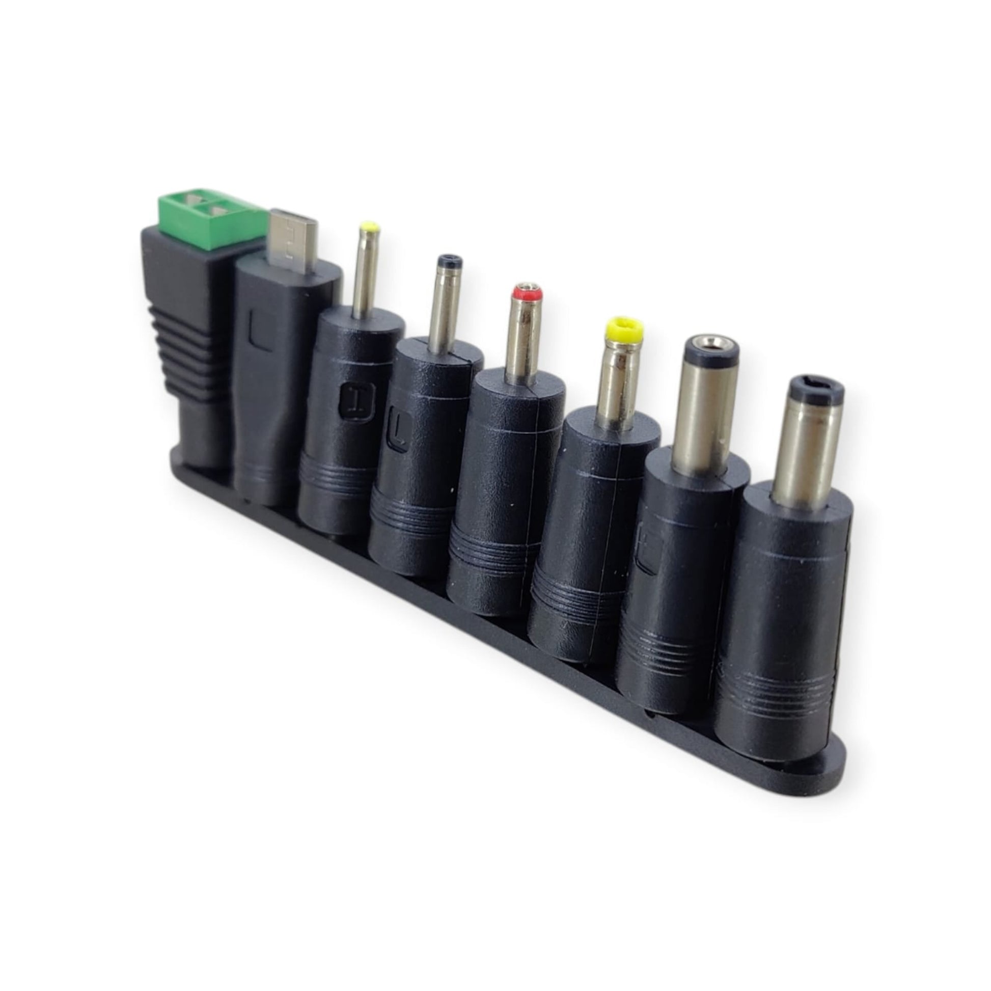 Close-up of the 8 interchangeable DC tips, including a green terminal block connector.