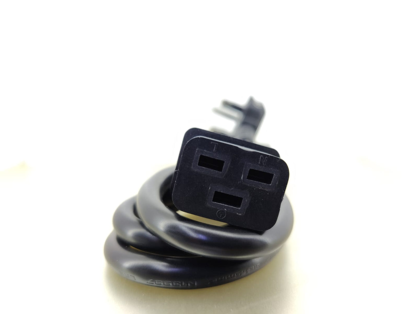 Detailed view of the C19 female connector on a power cord for high-current IT equipment.