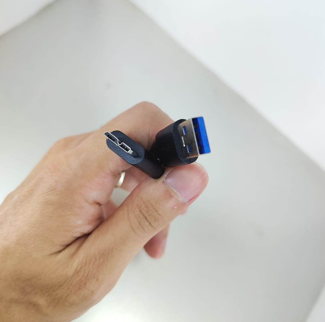 30cm USB 3.0 A Male to Micro B Cable held in hand, designed for external HDDs and SSDs, showing connectors.