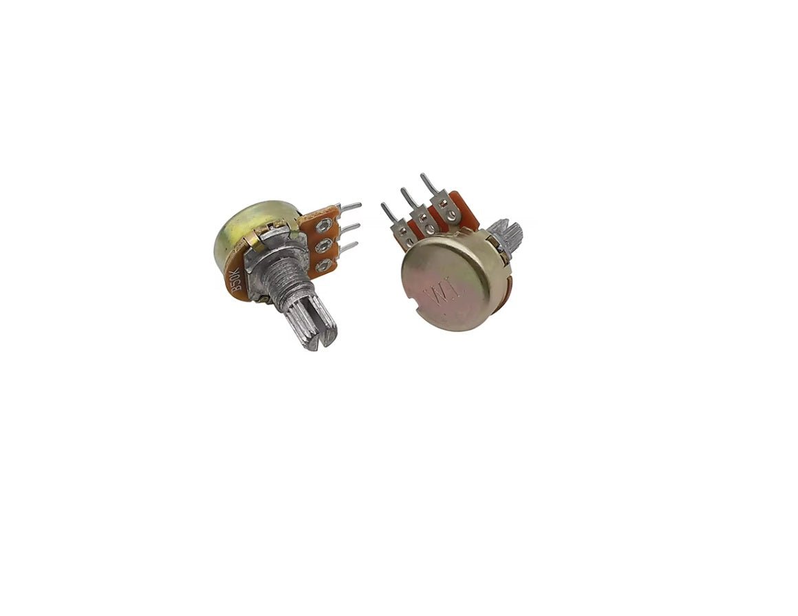 Two rotary potentiometers from the WH148 kit, showcasing a 15mm shaft and color-coded components.