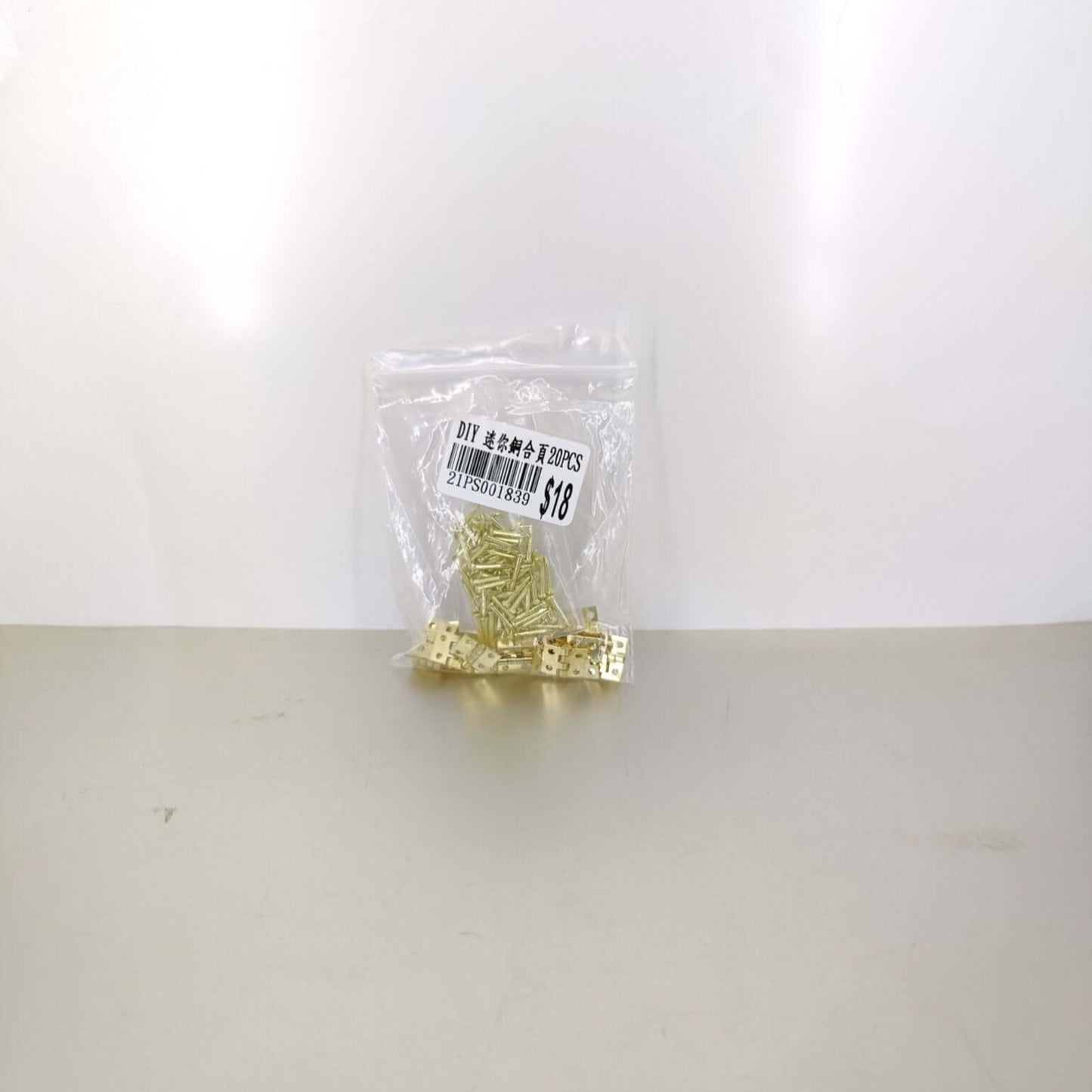 A pack of 20 mini hinges, sealed in a clear bag, labeled for DIY use and quantity, convenient for storage and shipping.