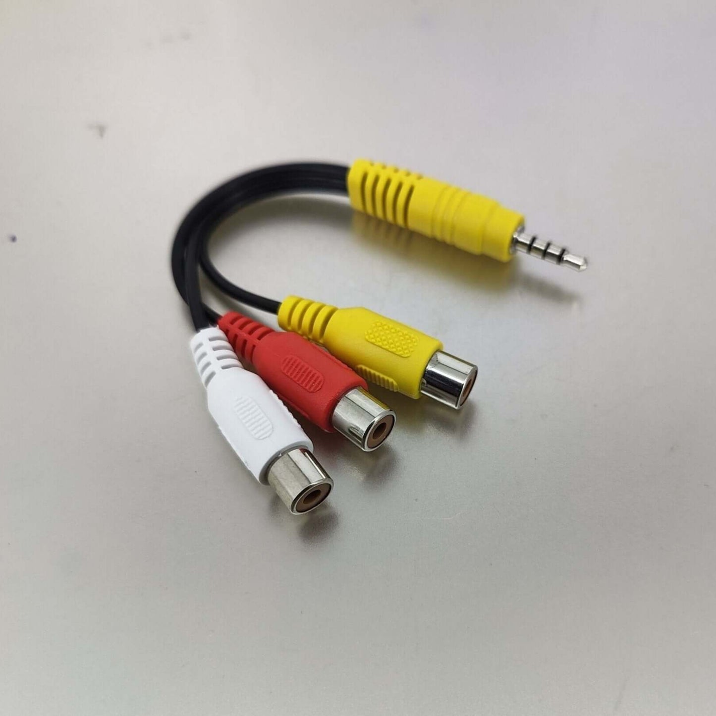 3.5mm to RCA AV adapter cable featuring yellow, red, and white connectors for audio/video connections.