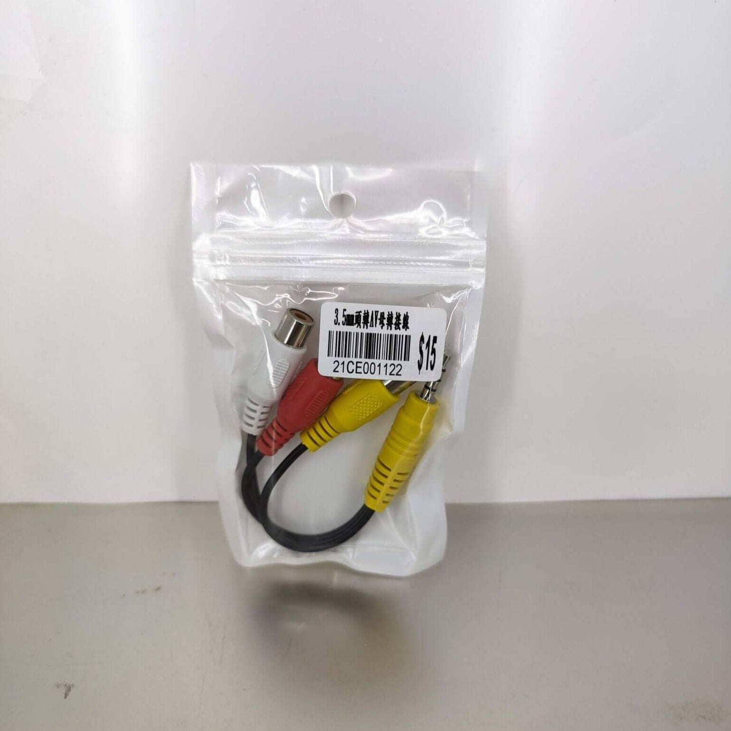 3.5mm to RCA AV adapter cable packaged, ideal for audio/video connection, high-quality signal transmission.