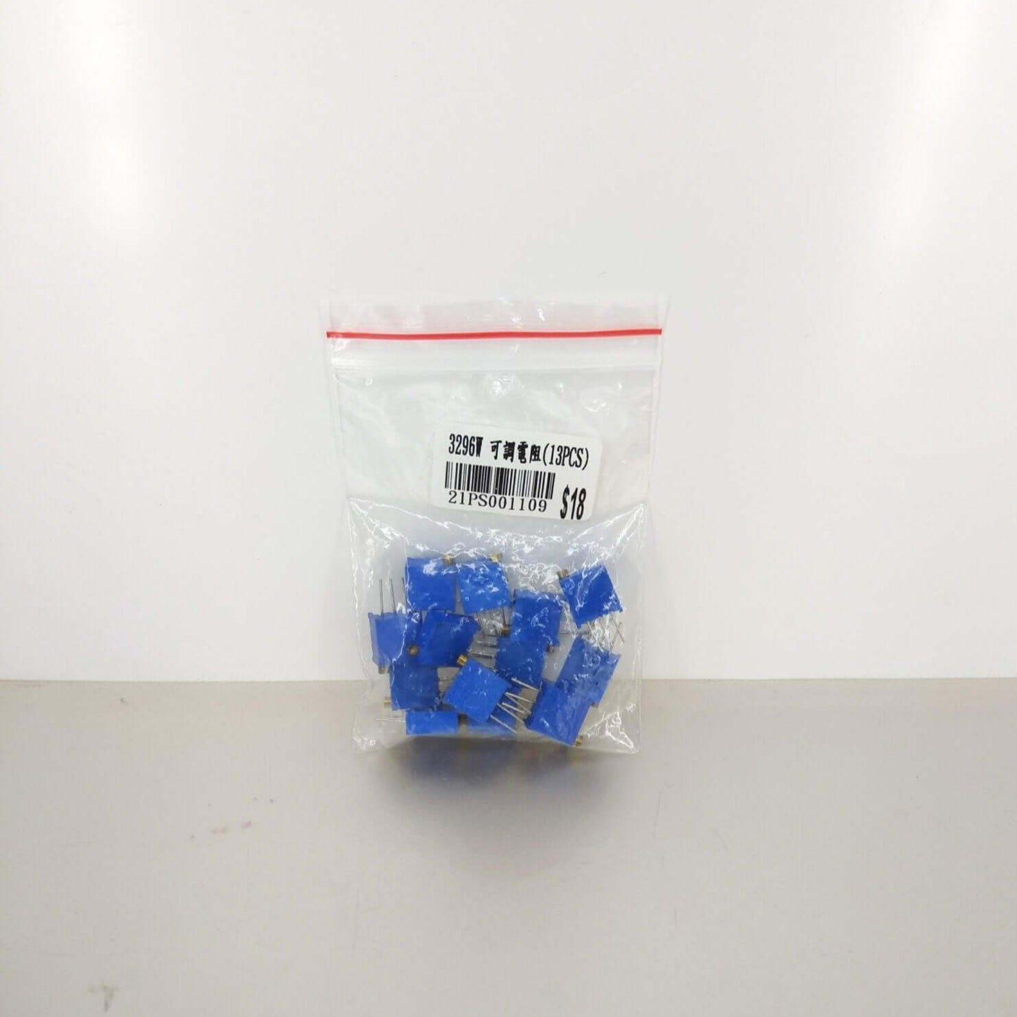 3296W Potentiometer Adjustable Resistor Kit 13pcs in a clear bag, featuring blue trimmer pots for versatile use.