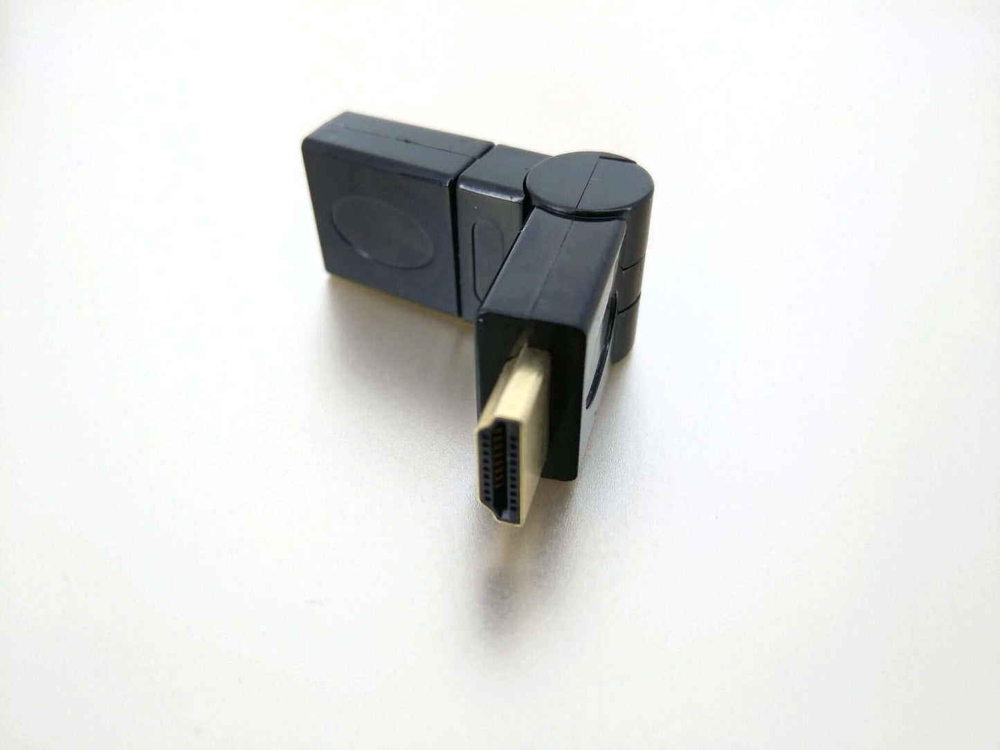 360° swivel HDMI 1.4 adapter, male to female, flexible connection for 1080p 3D setups.