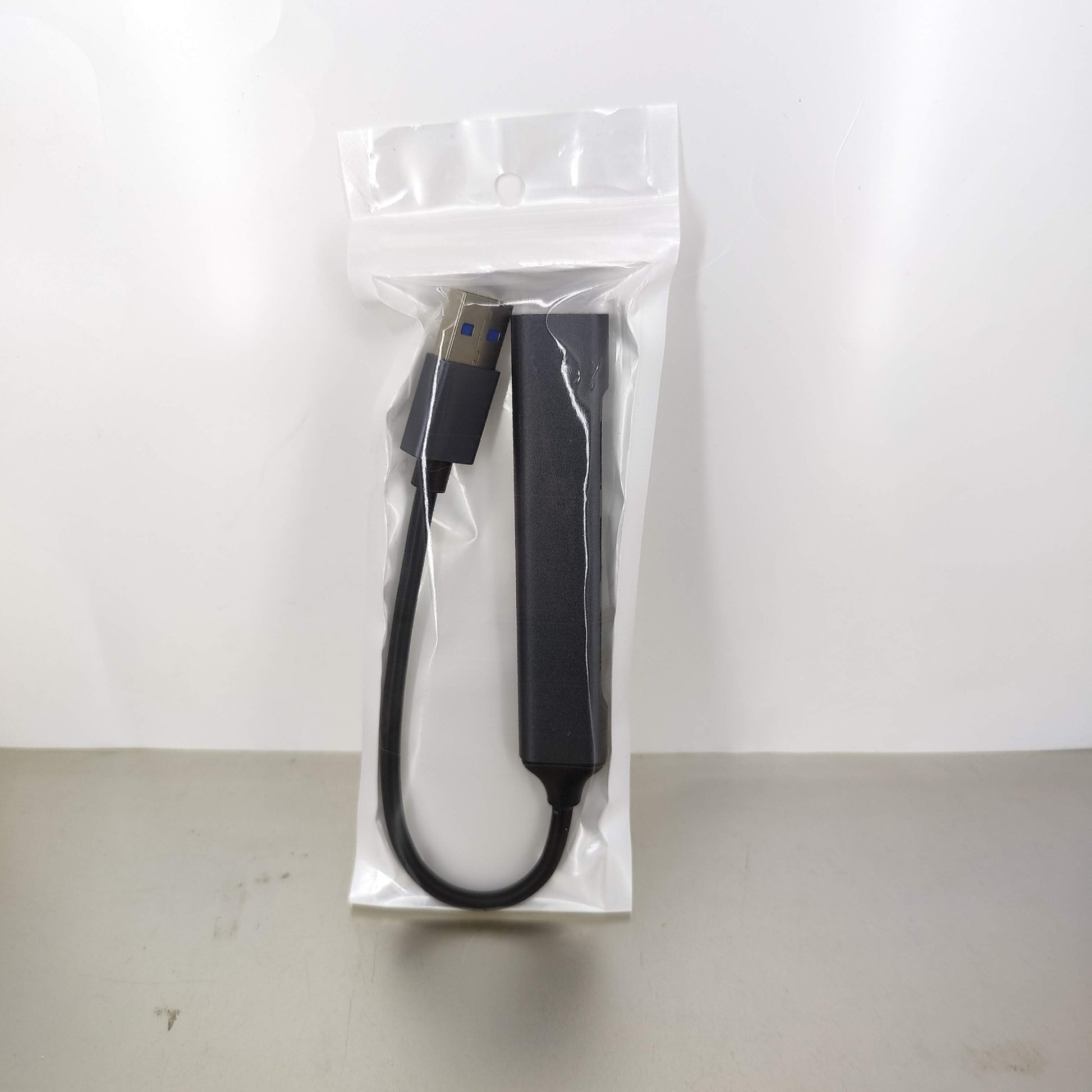 USB 3.0 4-port hub in packaging, featuring aluminum alloy design with a 2 ft cable for laptops and PCs.