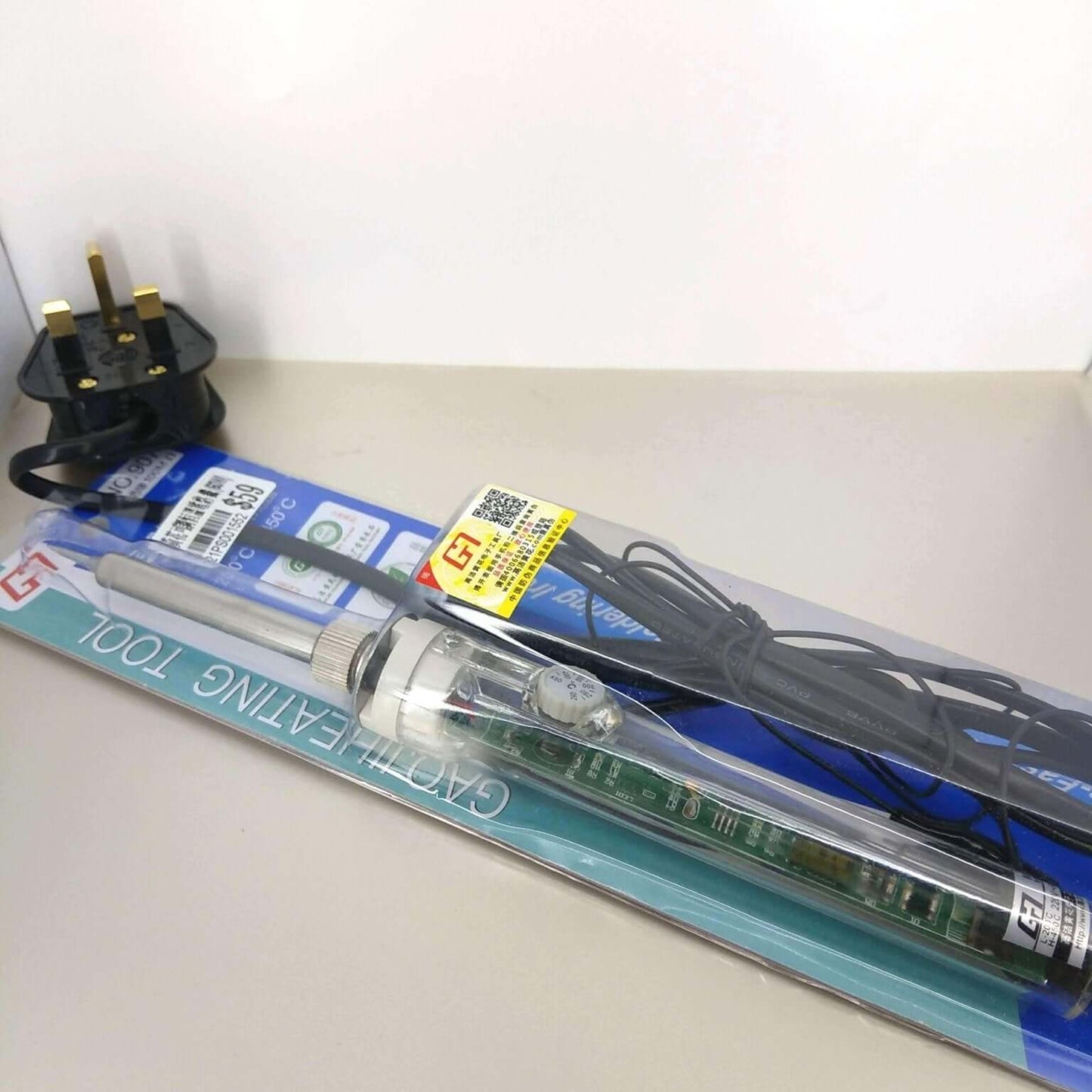60W adjustable temperature soldering iron kit with integrated temperature control, ceramic heating element, and plug.