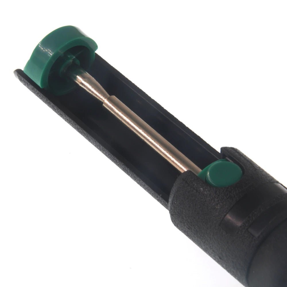 Close-up of a black plastic desoldering pump with a green button and metal tip, designed for efficient tin removal in soldering.