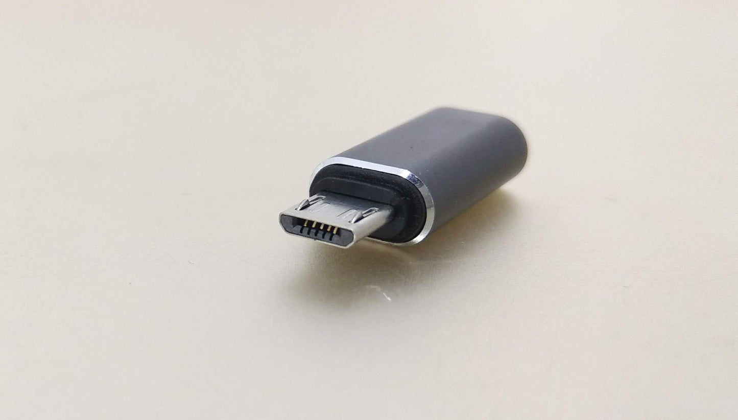 USB-C female to Micro USB male adapter for charging and data sync; compact and portable design.