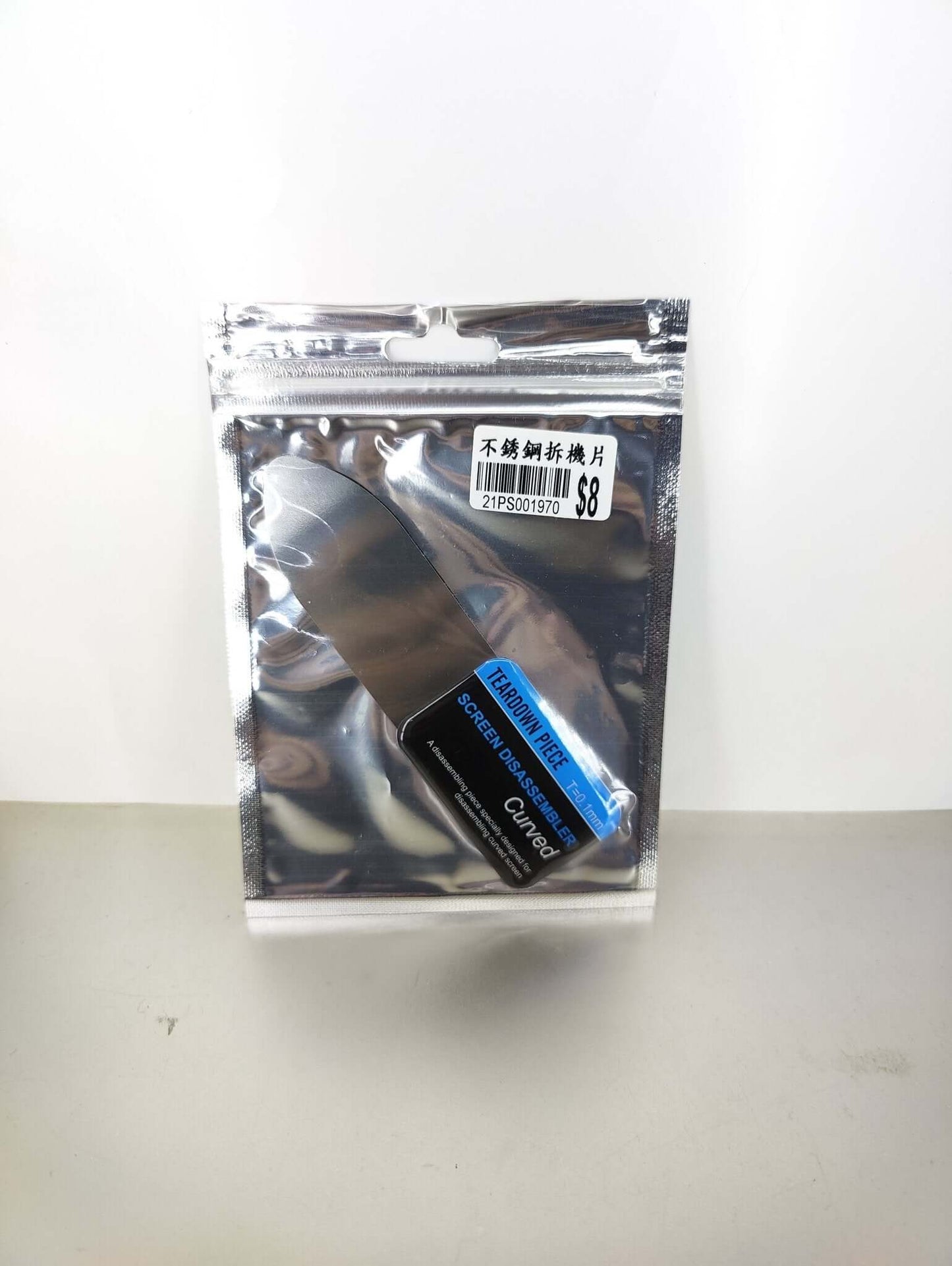 Mobile phone curved LCD screen teardown spudger in packaging, tool for easy device repair without damage.