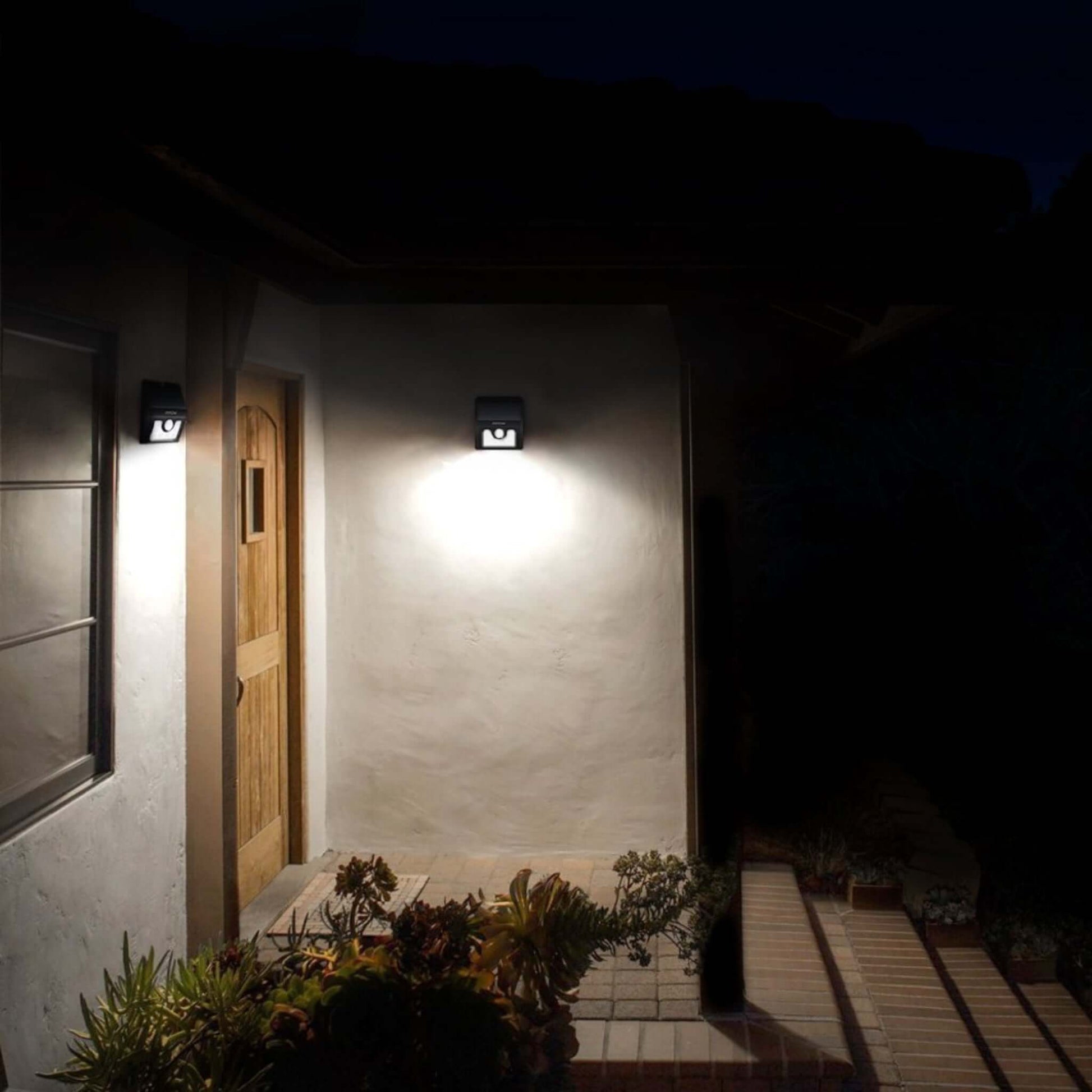 Outdoor space illuminated by Mpow 8 LED Solar Motion Sensor Light showcasing security and brightness at night.