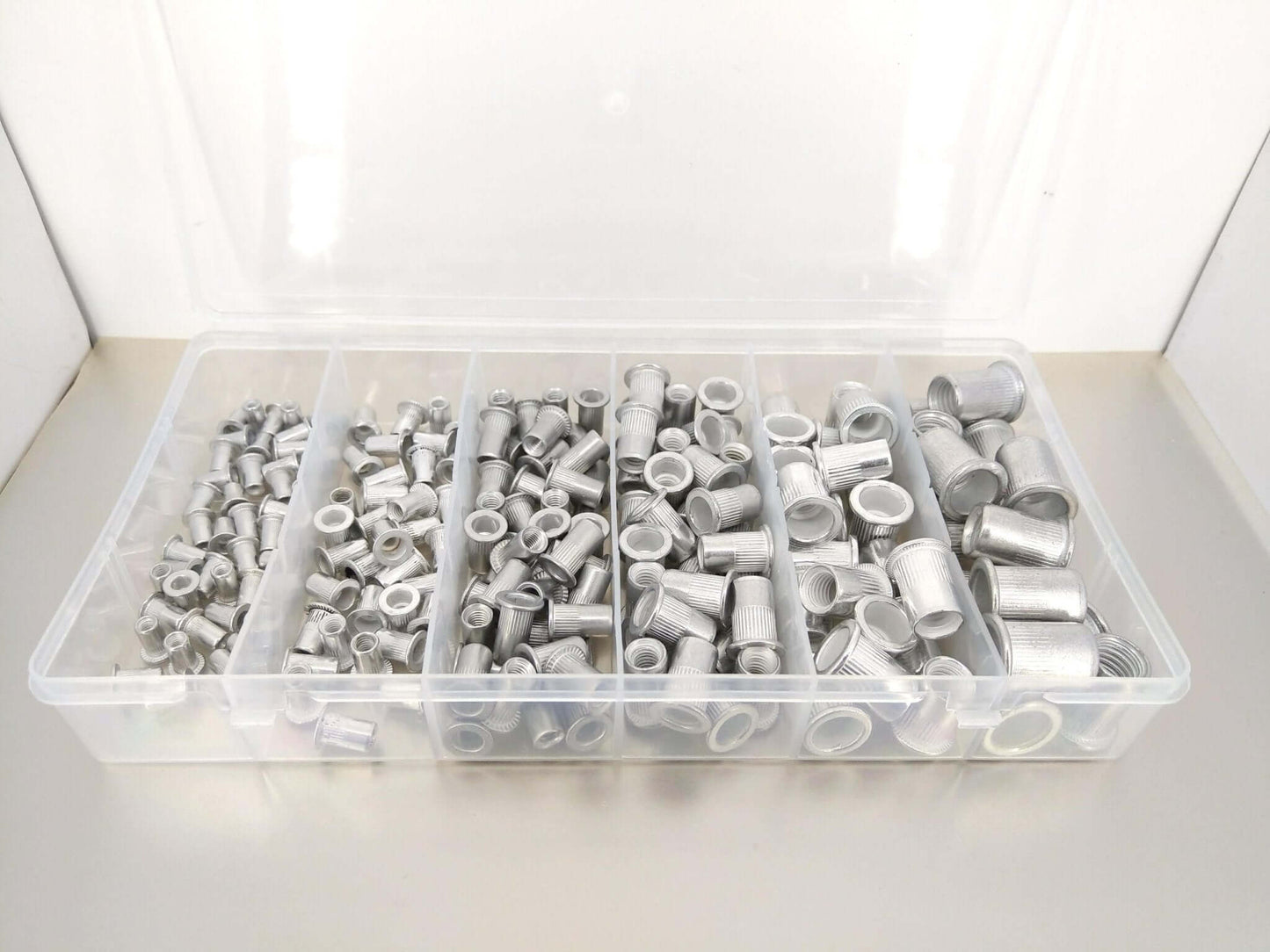 190-piece Aluminum Rivet Nut Kit displayed in a clear storage box, featuring various sizes of threaded inserts.