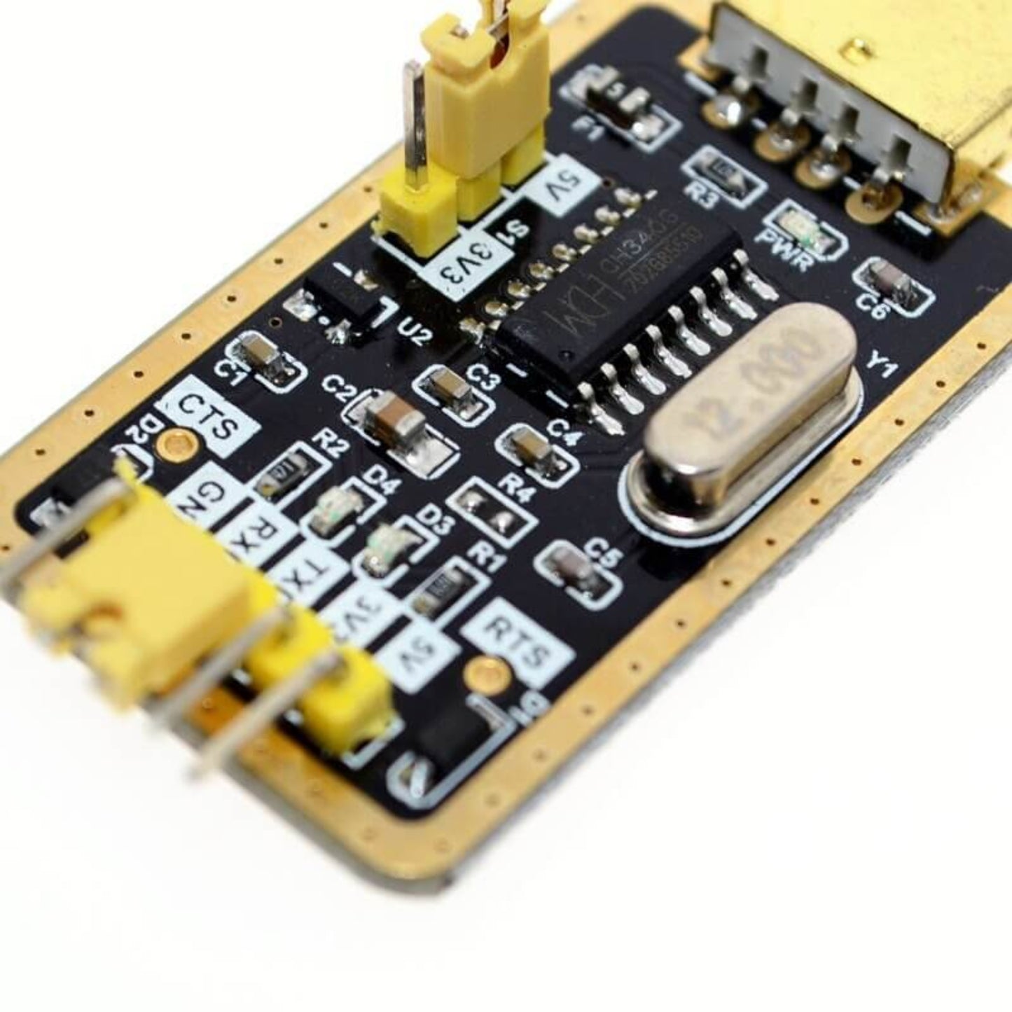 CH340G RS232 to TTL module close-up with golden pins and chips for reliable USB to serial connections.