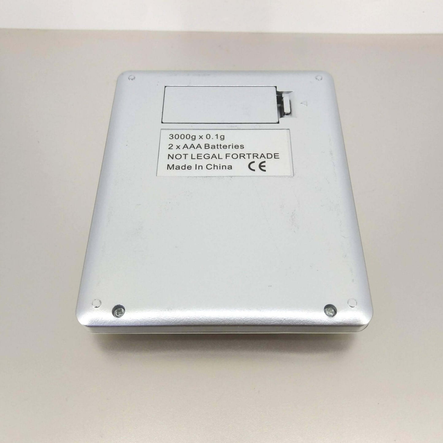 Back view of High Precision Digital Pocket Scale, 3000g capacity, 0.1g accuracy, powered by 2 AAA batteries.