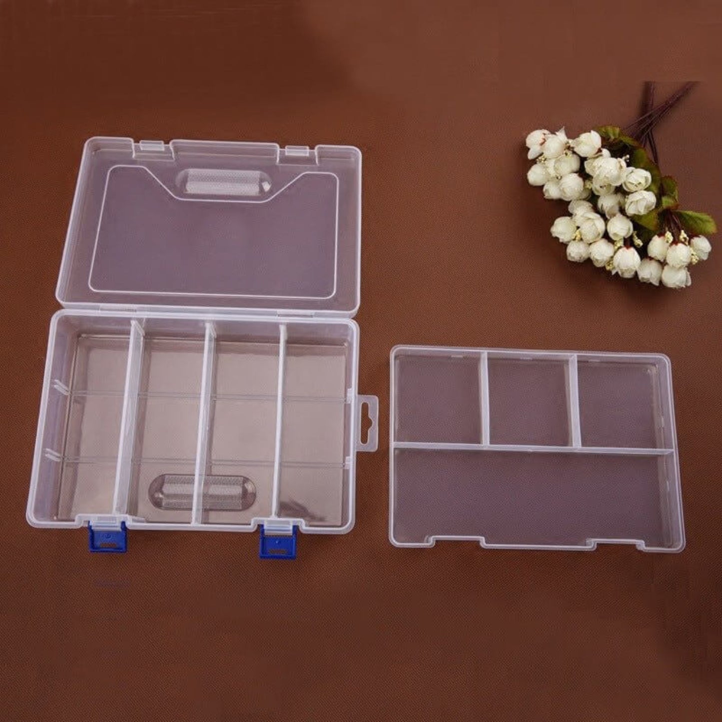 Double-layer transparent plastic storage box with 8 grids for organizing small items and jewelry.