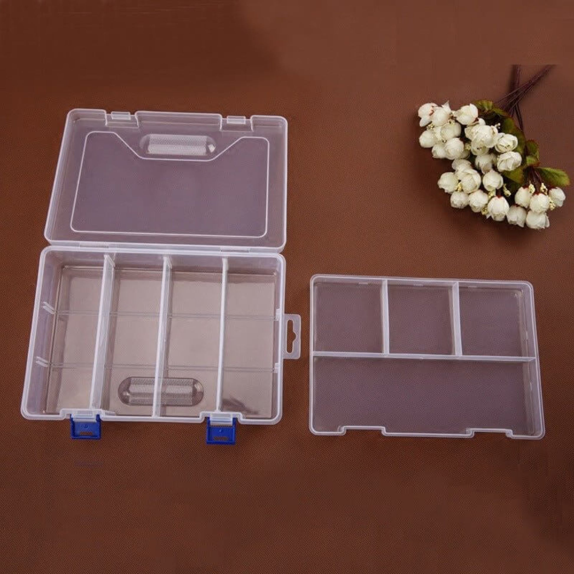 Double-layer transparent plastic storage box with 8 grids for organizing small items and jewelry.