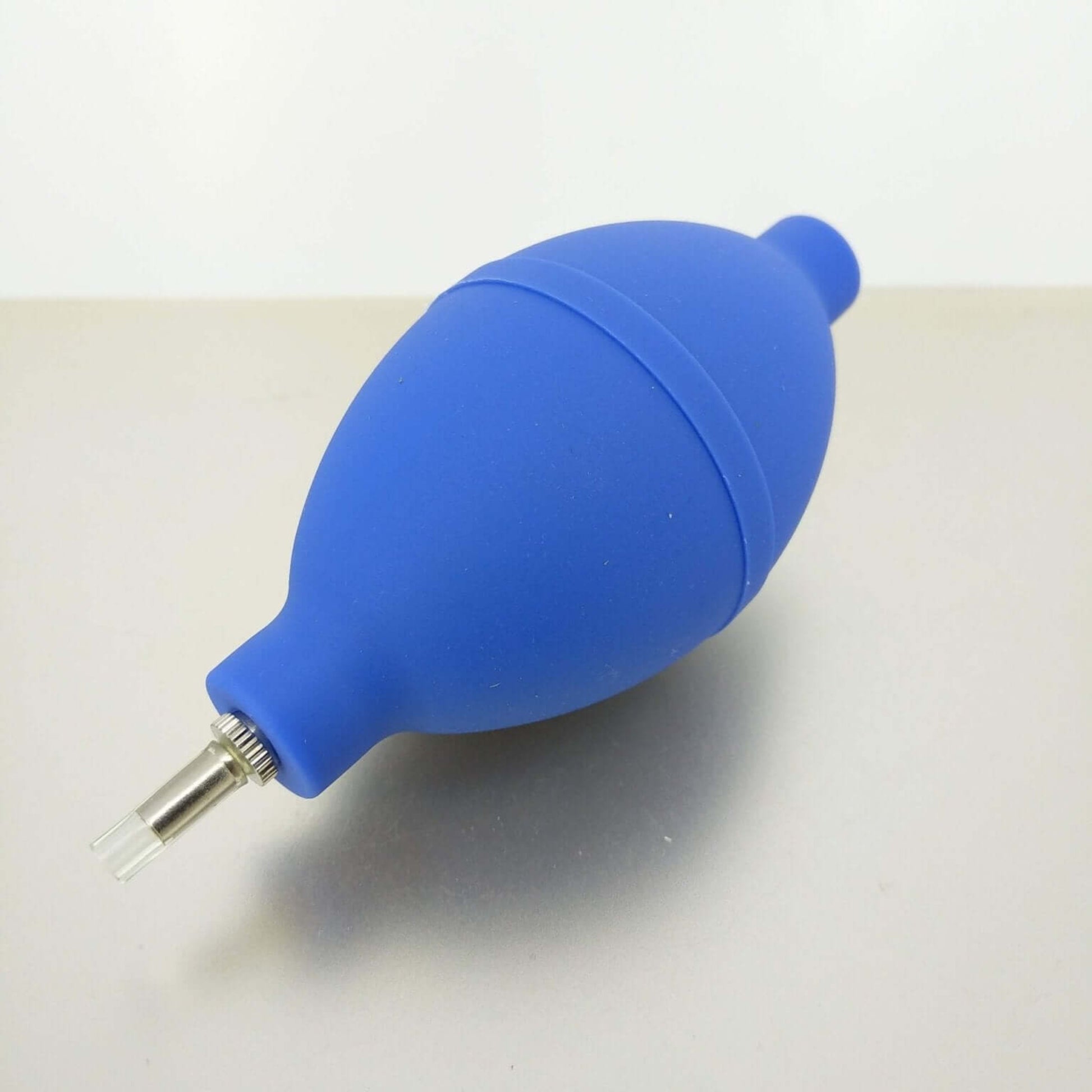 Mini blue rubber dust blower ball for cleaning camera lenses and keyboards, compact and portable design.