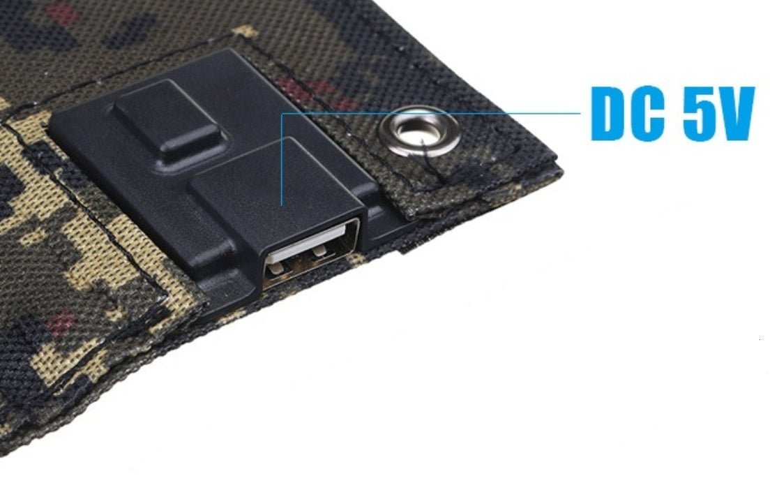Close-up of the USB output and DC 5V connector on a foldable solar charger panel.