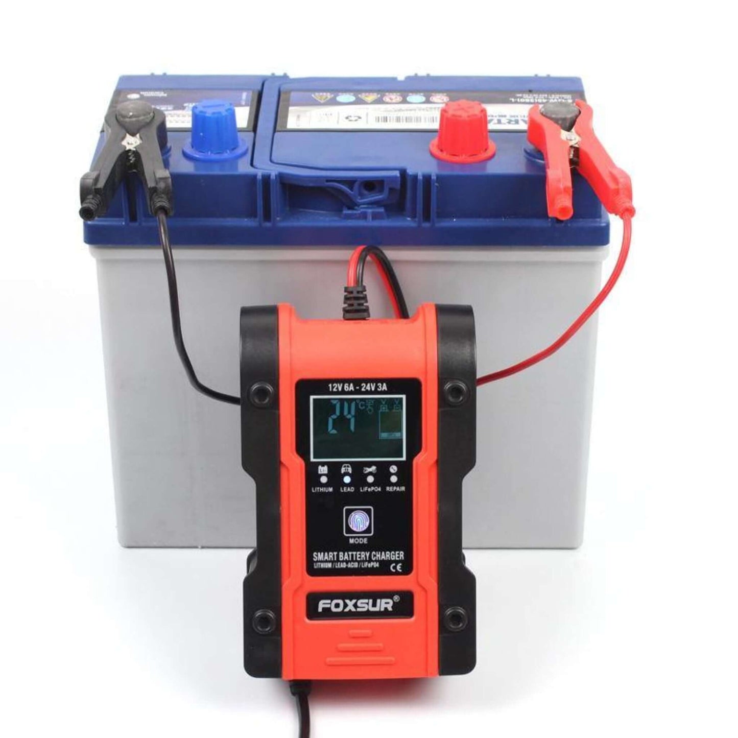 Foxsur 12V/24V Smart Battery Charger displaying "24.0" while charging a single car battery.