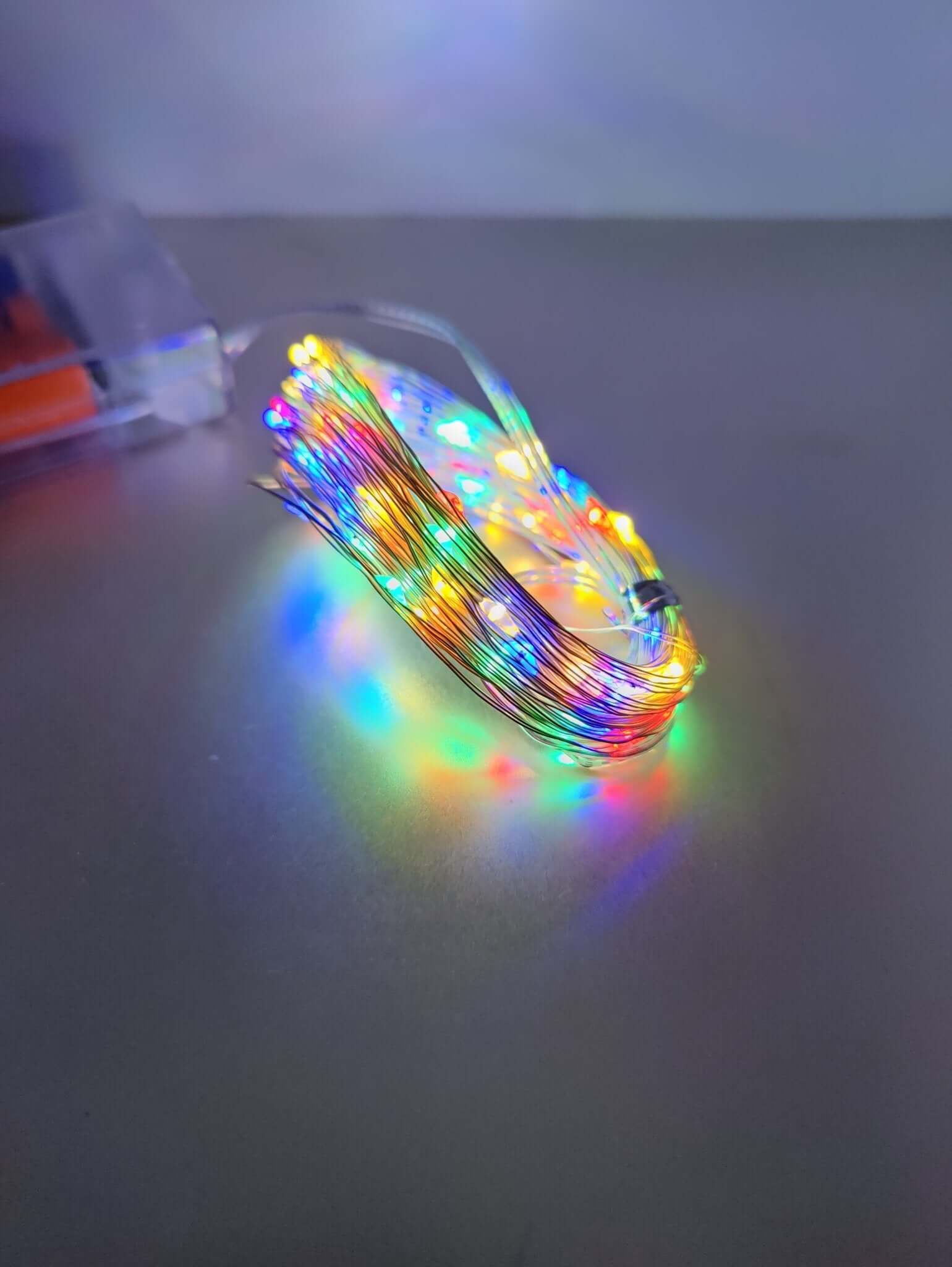 Multicolor LED fairy lights on a silver wire, perfect for decorating spaces with a vibrant glow.