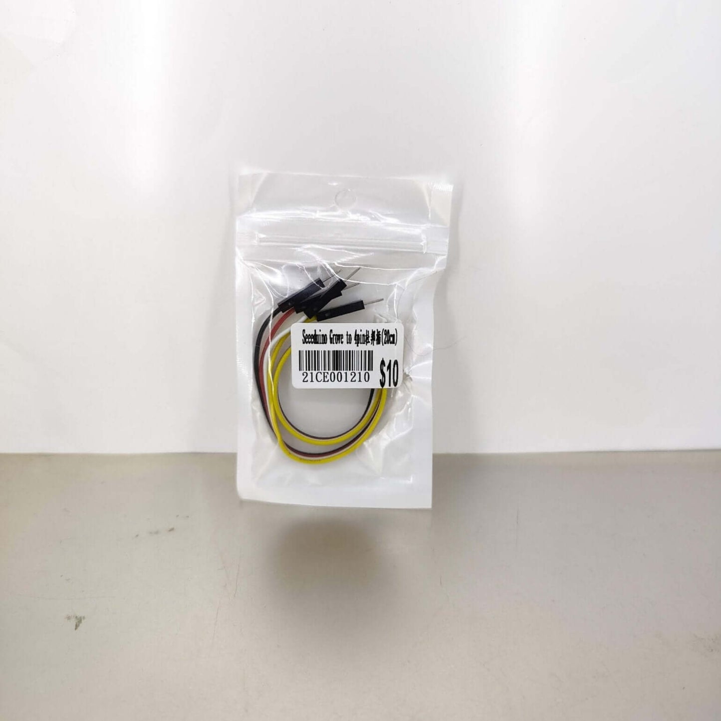 Grove to 4-pin male jumper cable in sealed retail packaging with the product name and $10 price tag visible.