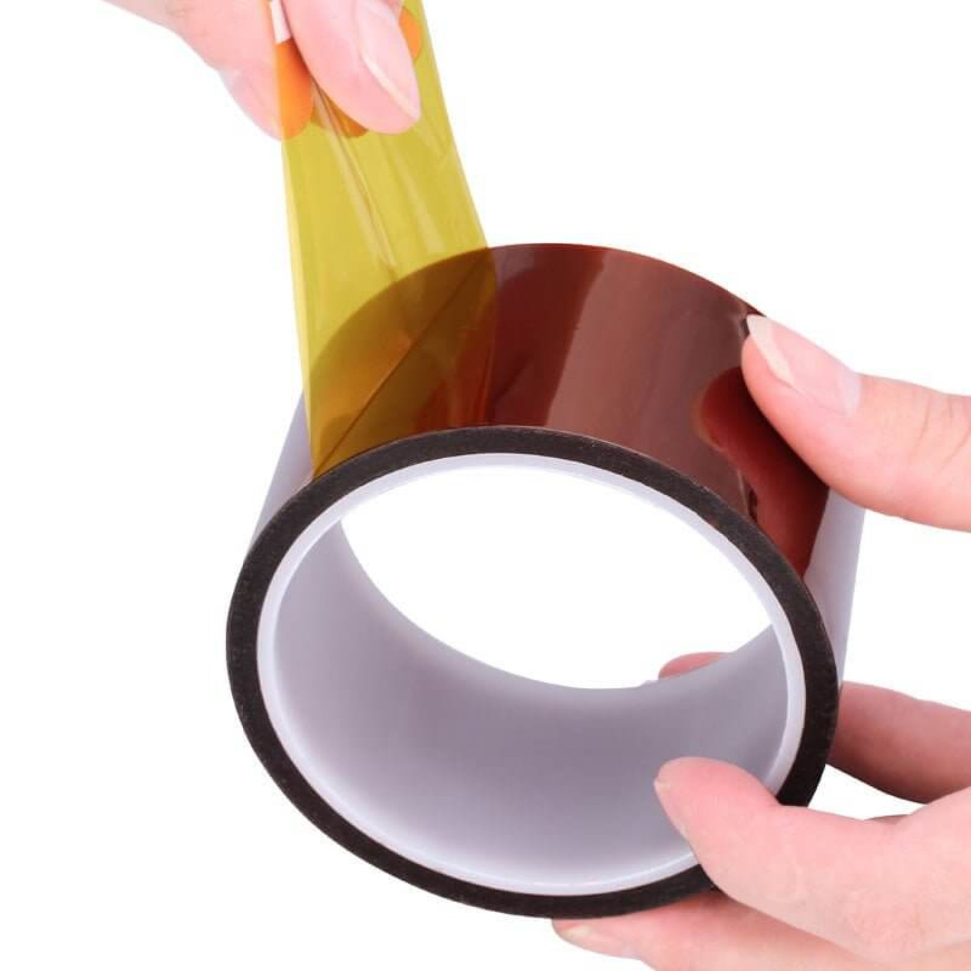Hands peeling high temperature polyimide tape for heat resistant electrical insulation.
