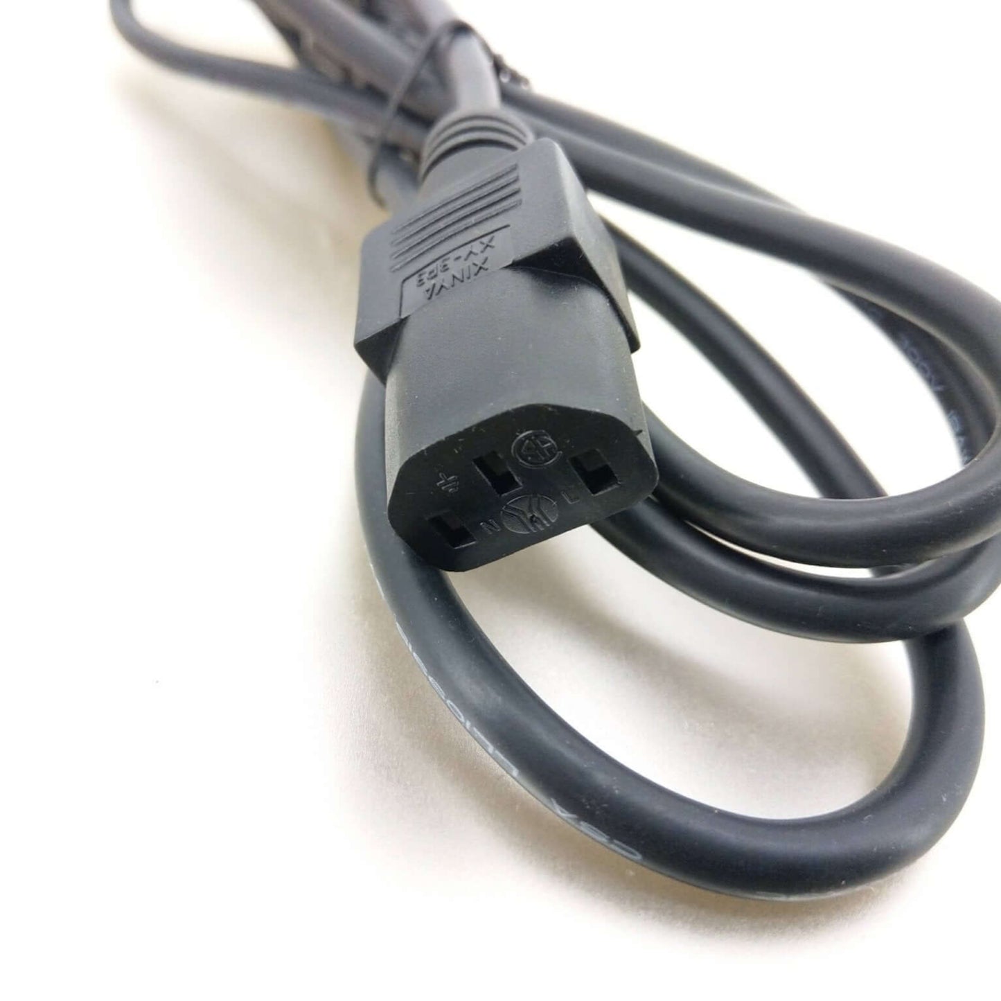 IEC-320-C13 female end of the universal power cable, compatible with diverse electronic devices.