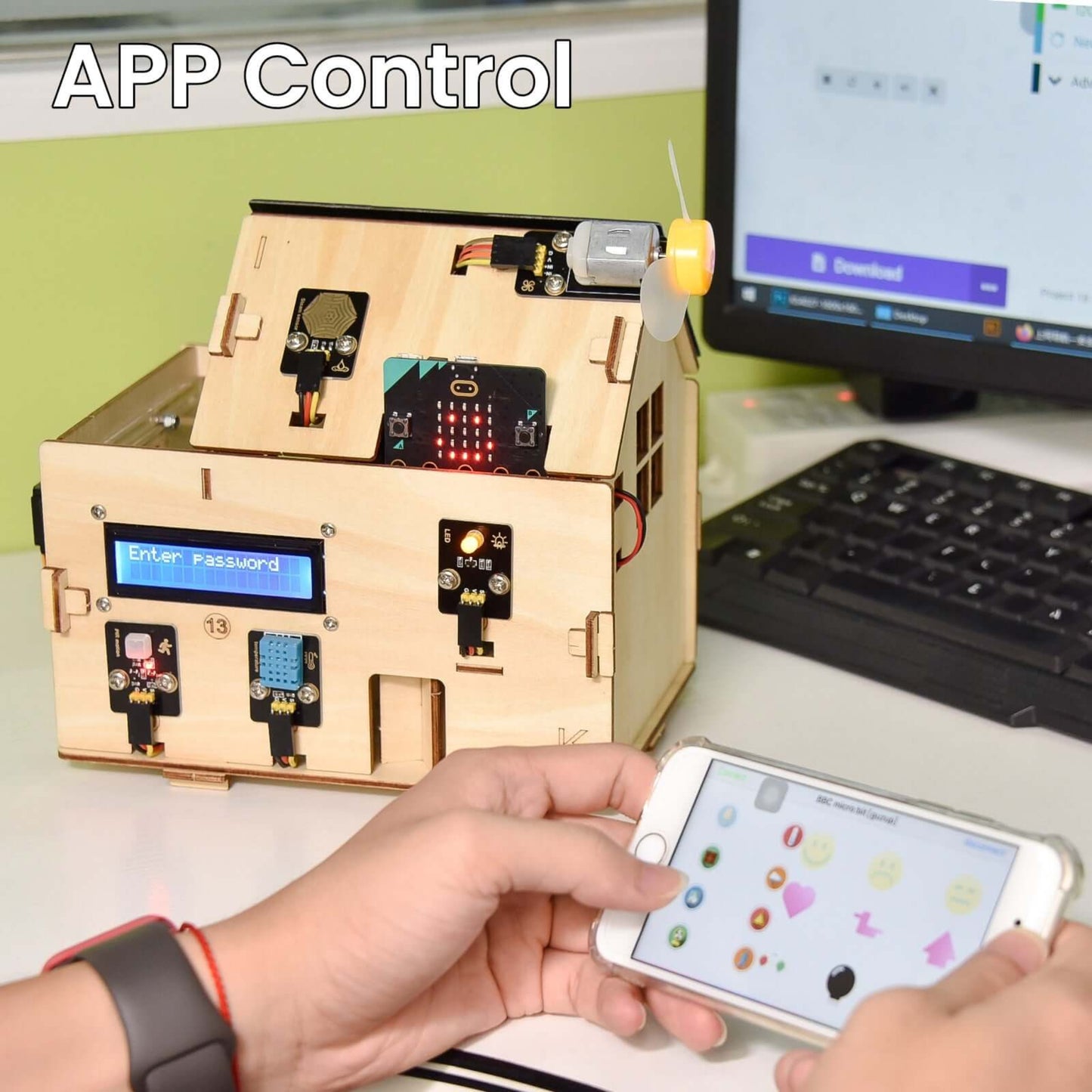 Hand operating a smartphone while controlling a wooden smart home model via app, showcasing Keyestudio IoT technology.