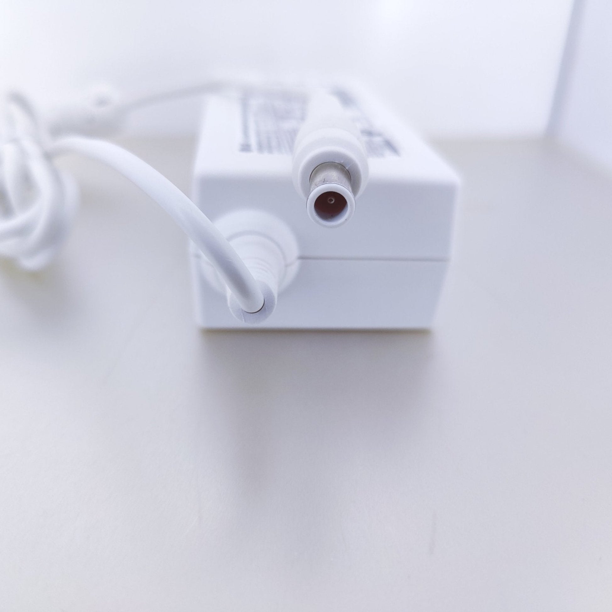 Close-up of the DC connector pin for LG 19V 2.53A monitor power supply.