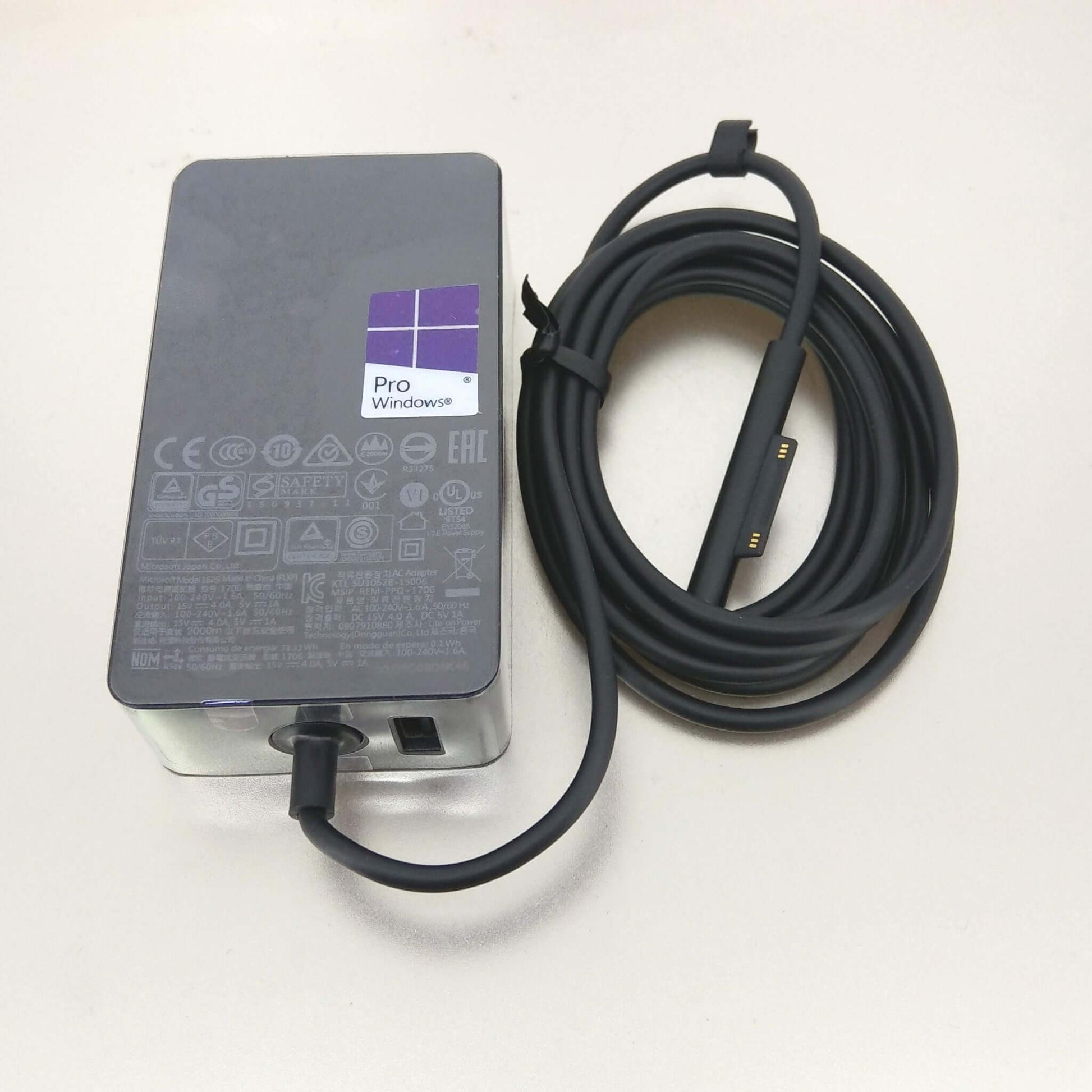 Microsoft Surface 65W Power Adapter Charger Model 1706 with cable and Windows Pro logo.