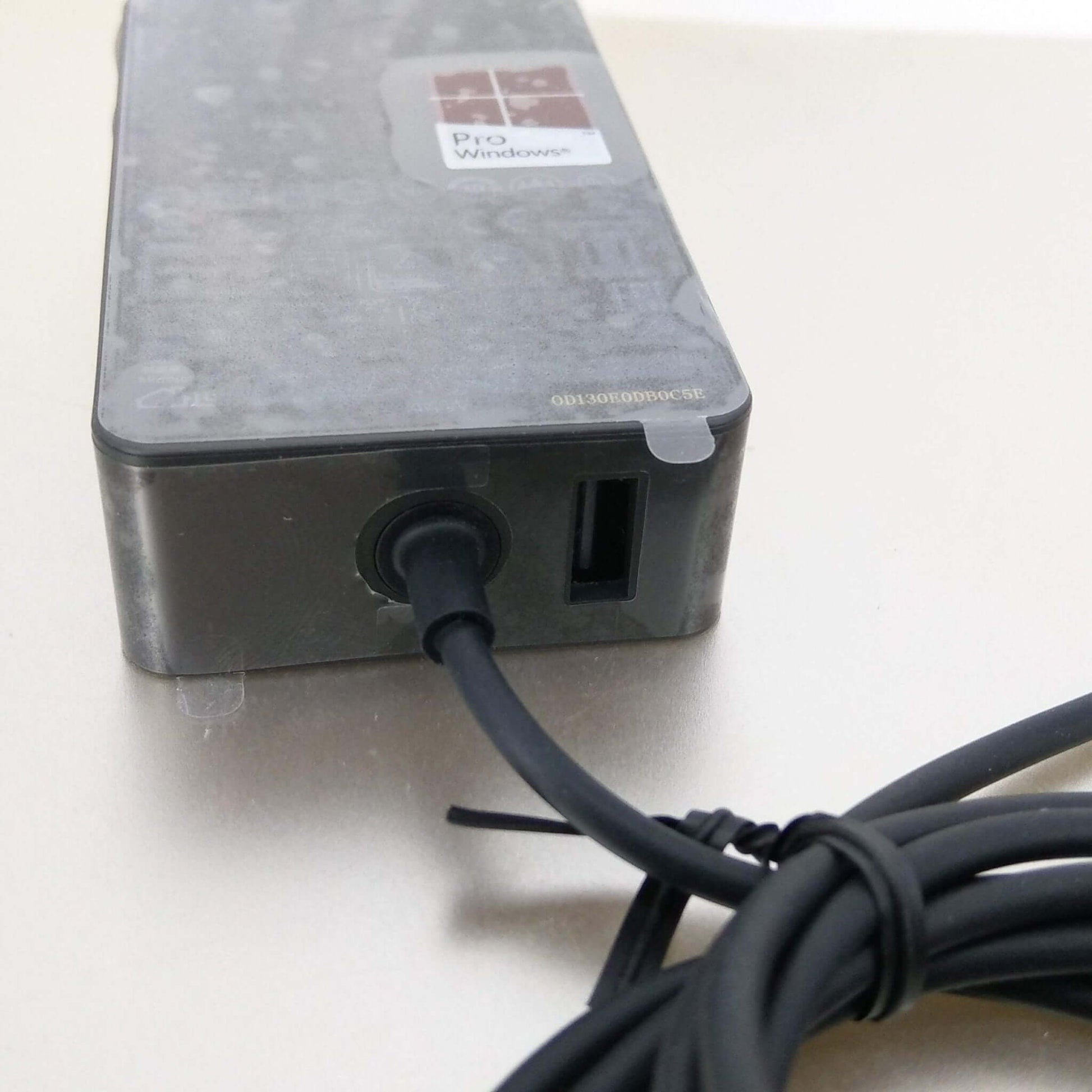 15V 2.58A power adapter for Microsoft Surface Pro and Laptop Go, featuring a USB and charging cable.