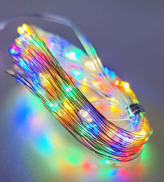 Multicolor LED fairy lights on silver wire, creating a vibrant glow for festive decorations.