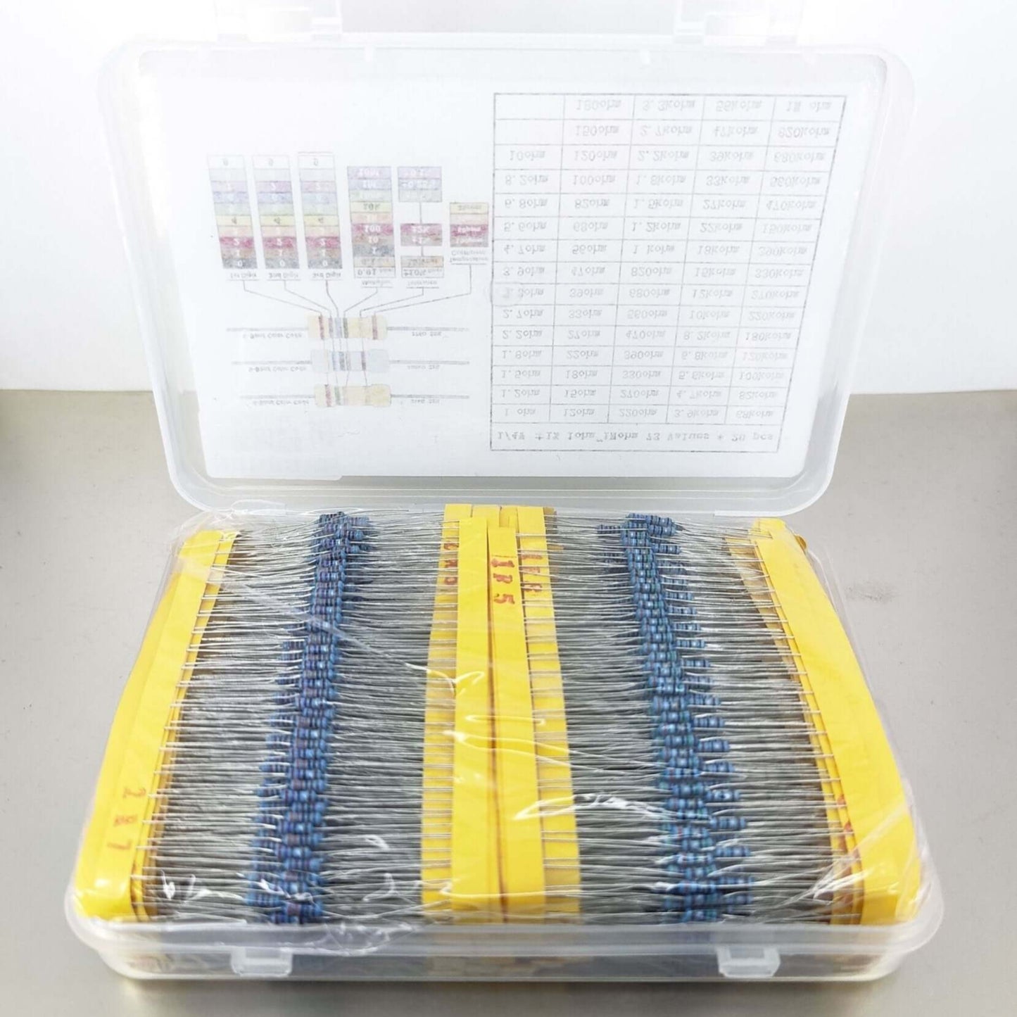 73 types metal film resistor kit in transparent case with yellow labels and organization chart.