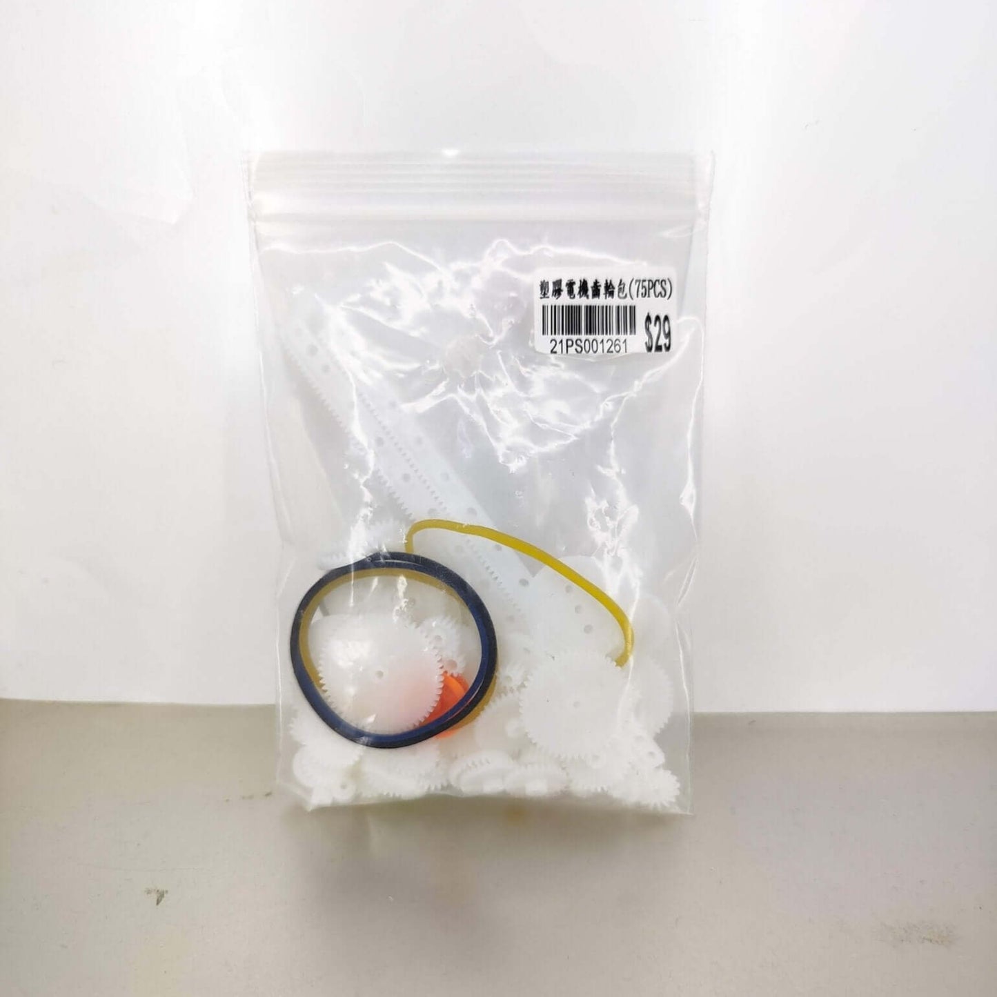 Repairing a remote-controlled car using the 75-piece replacement gear kit.