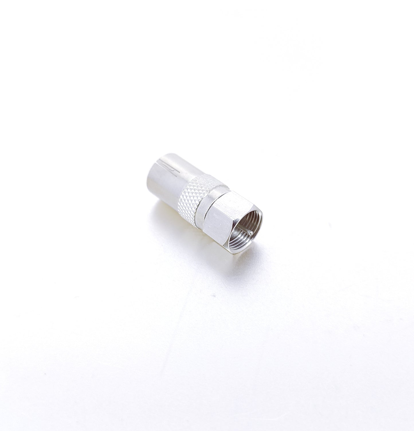 Close-up of a silver RF female socket to F-Type screw male plug adapter converter, showing the threaded F-Type male end.