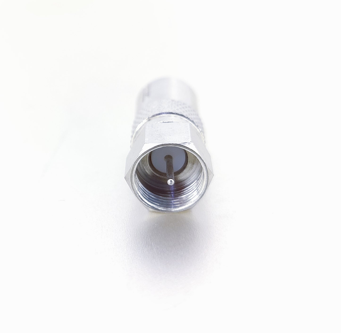Front-on view of the F-Type screw male plug end of the silver RF to F-Type adapter, showing the threaded exterior and the central pin.