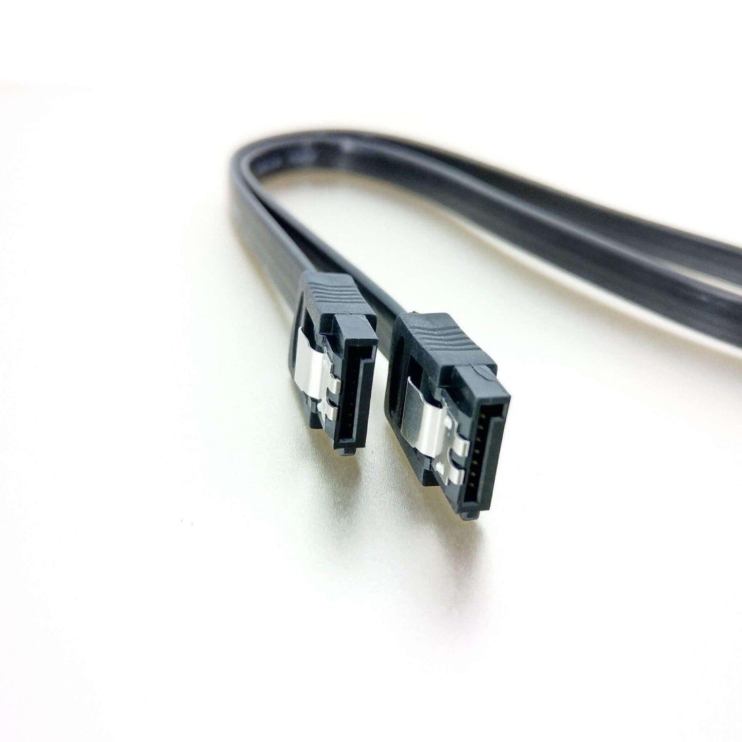 Close up of the sturdy metal locking latches on the SATA 3 cable connectors.
