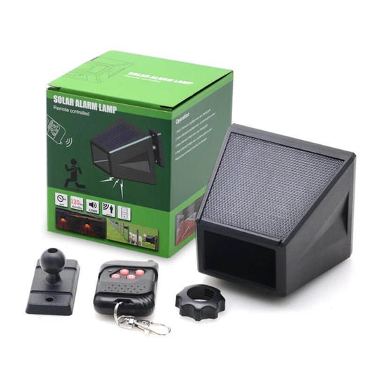 Solar Alarm Lamp remote control and package, showing features: motion sensor, anti-theft, and animal driver.