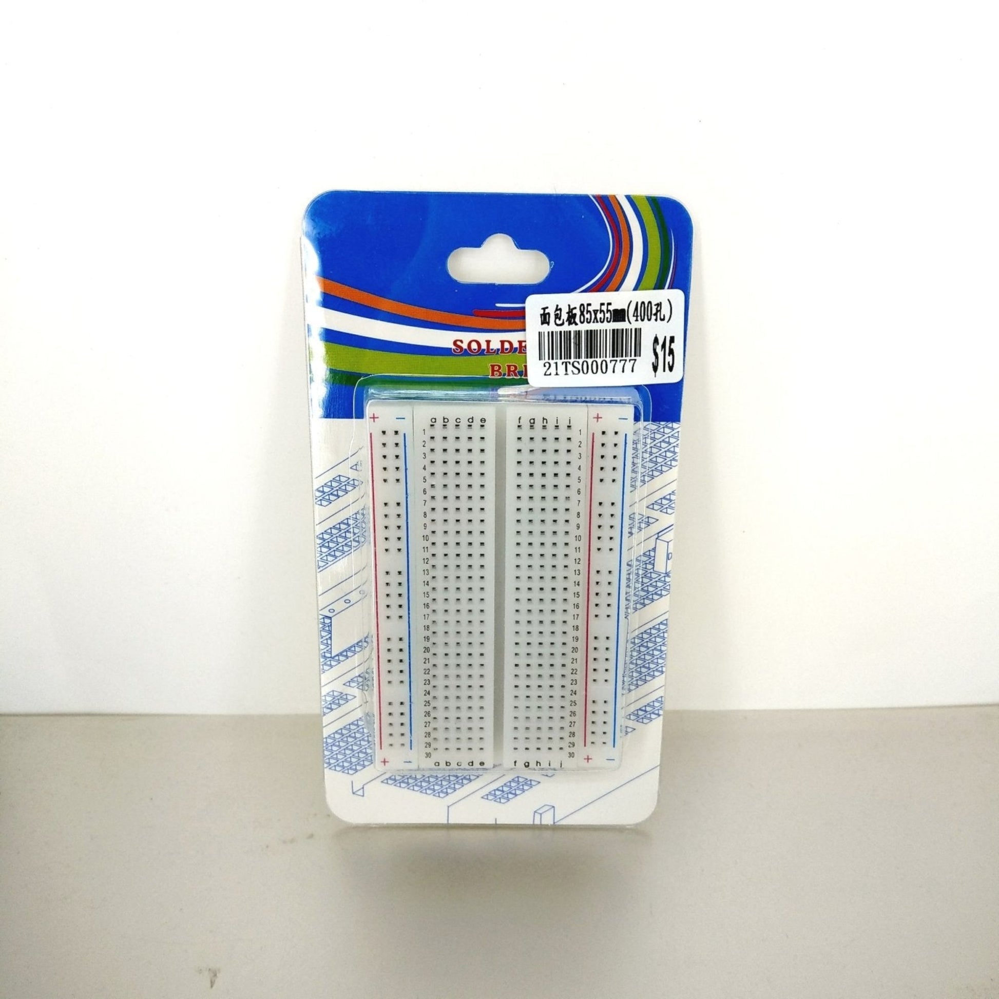 Front view of a 400 tie-point solderless breadboard in retail packaging, showing two white breadboards.