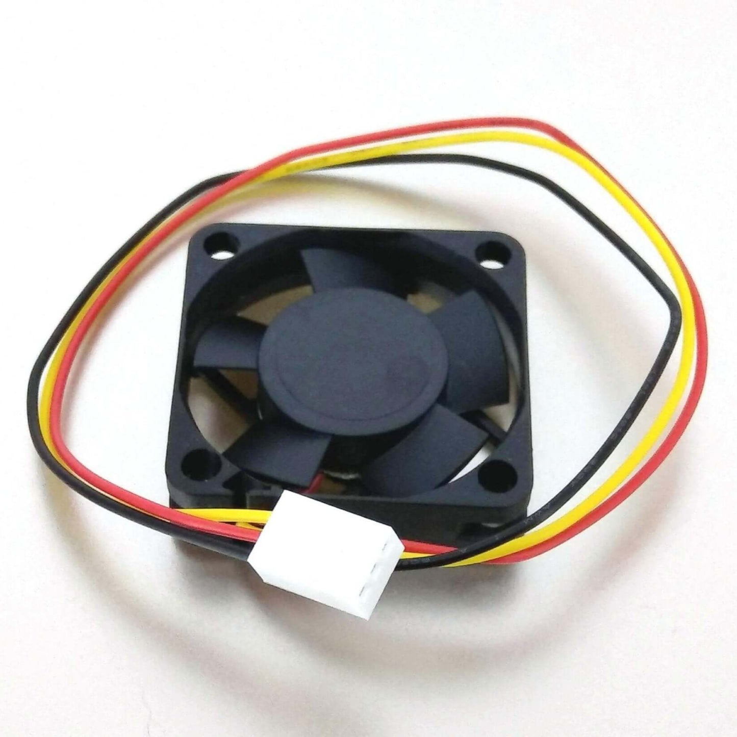Back view of a black SUNON 40mm cooling fan showing the fan blades and the red, black, and yellow wires leading to a white 3-pin connector.