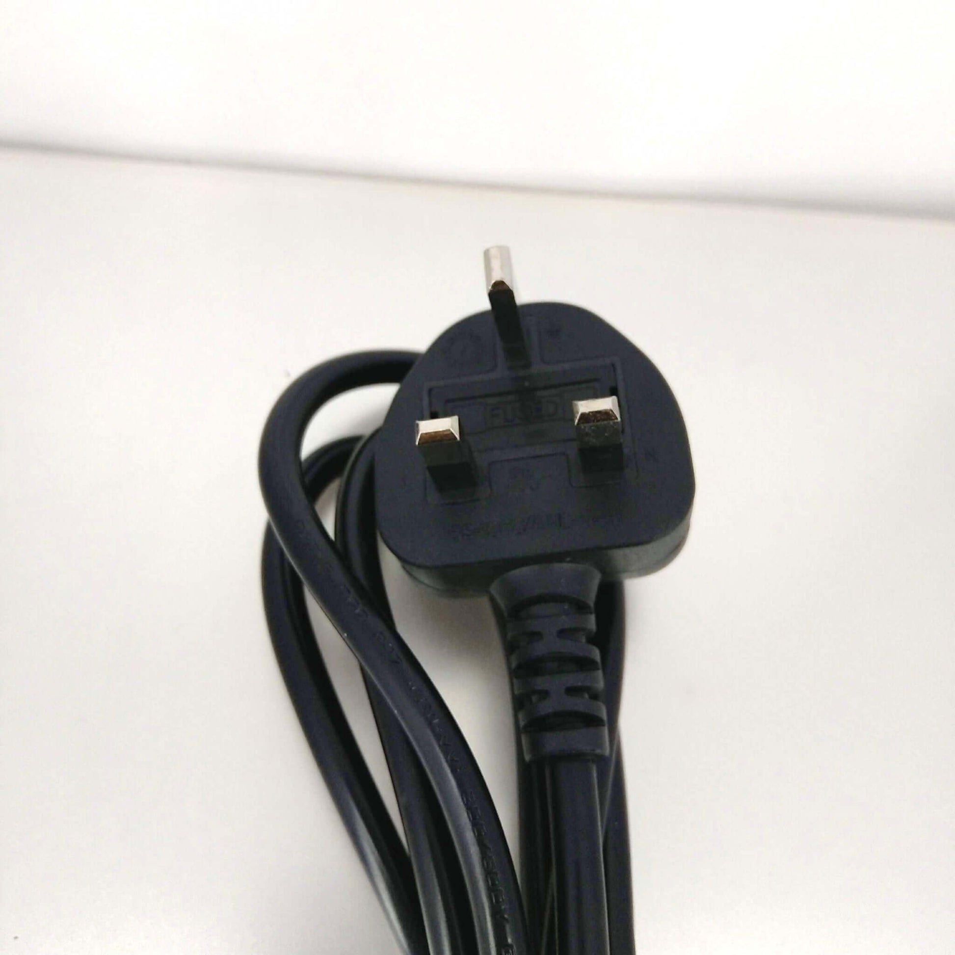 Close-up of a UK 3-pin power plug for C5 "Mickey Mouse" power cable, ideal for laptops and electronics.