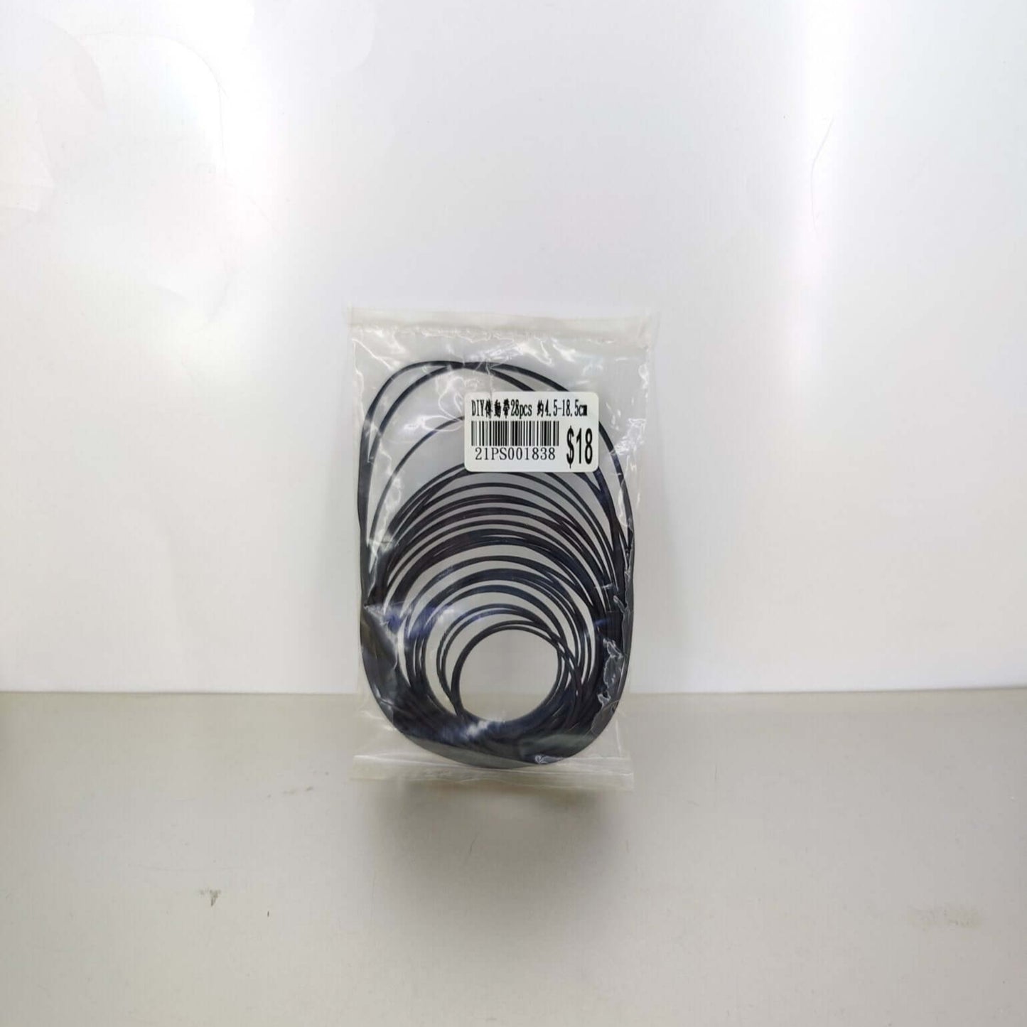 Universal 1mm square rubber drive belt mix packaged in clear bag with label, suitable for electronics repair.
